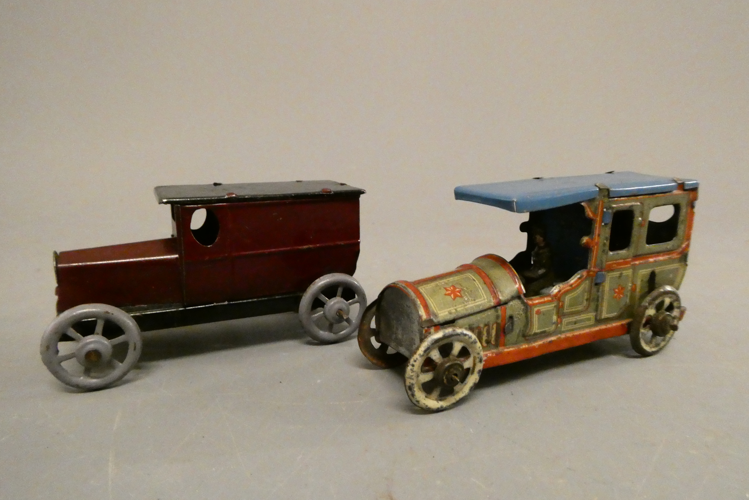 Two German made tinplate penny toys comprising 1920's saloon and delivery van, fair (Est. plus 24% Image
