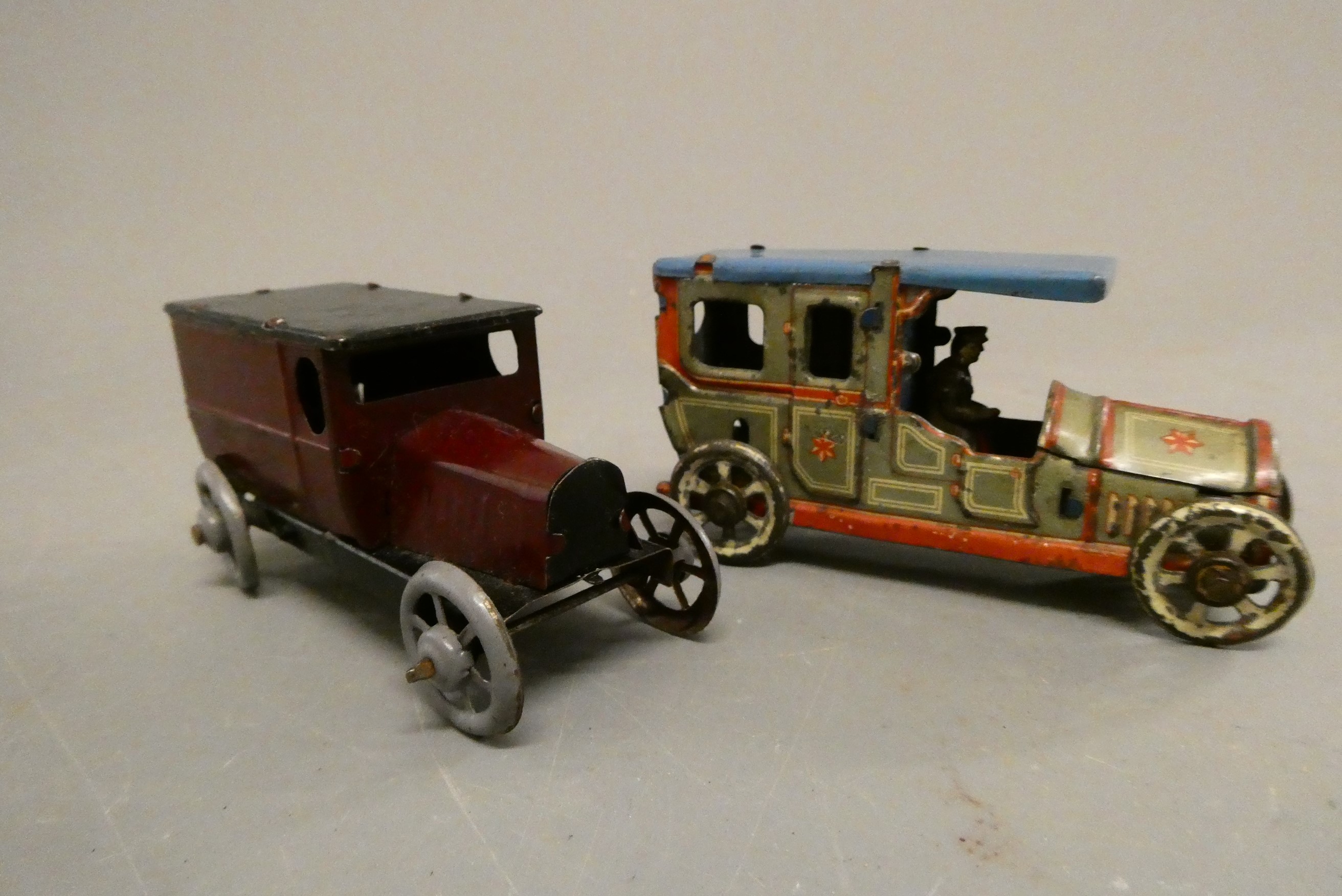 Two German made tinplate penny toys comprising 1920's saloon and delivery van, fair (Est. plus 24% Image