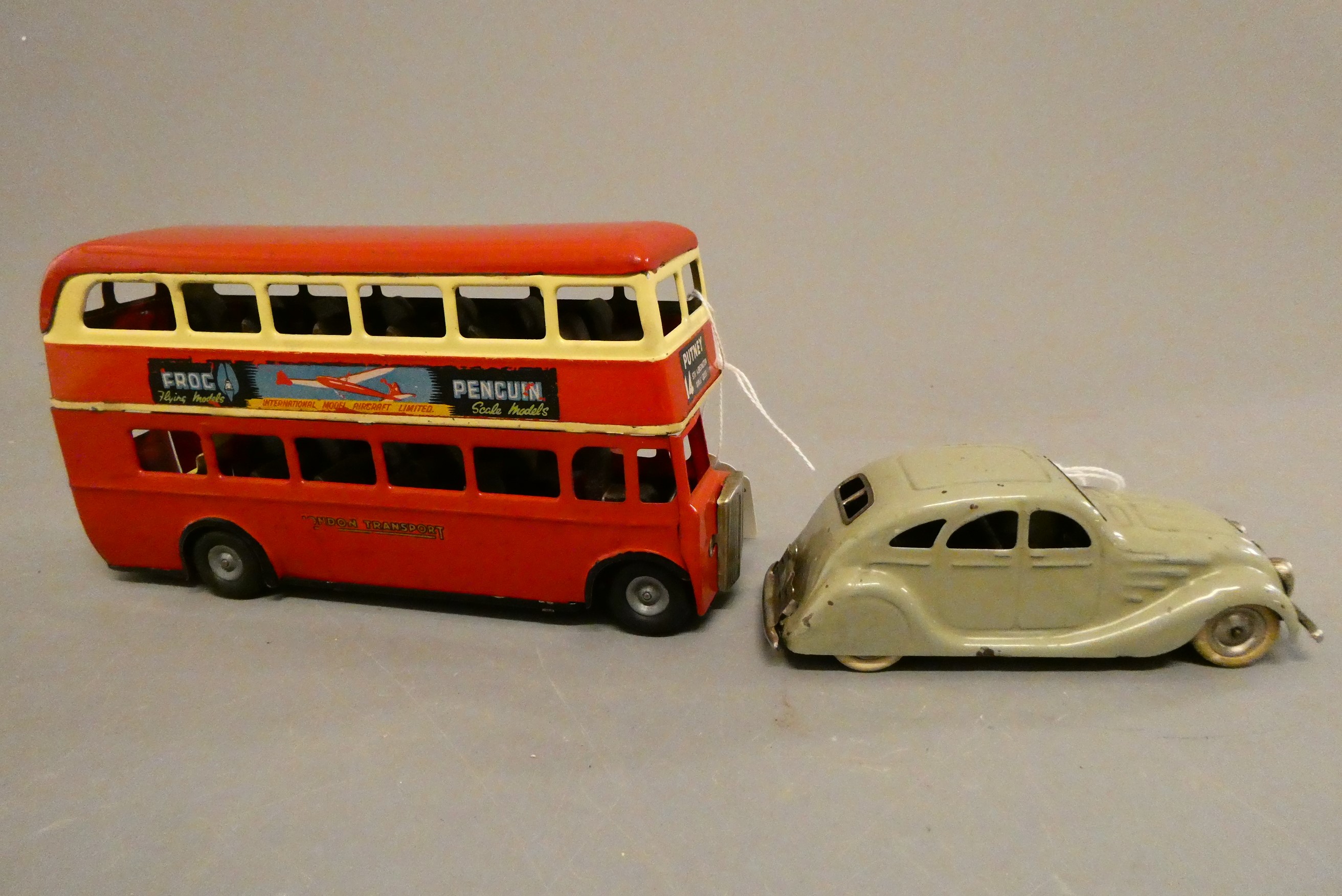 Triang Minic clockwork bus, some minor damage to transfers, otherwise good, and a grey Minic saloon Image