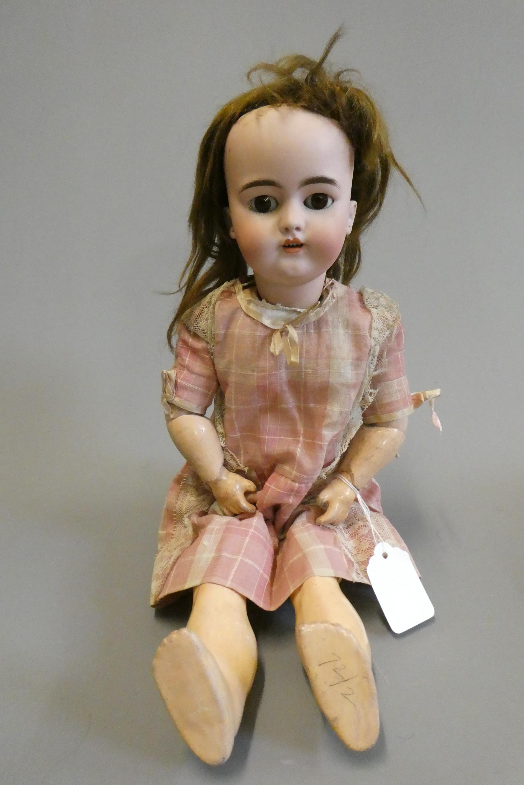 A Simon & Halbig bisque socket head doll with head turning mechanism Image