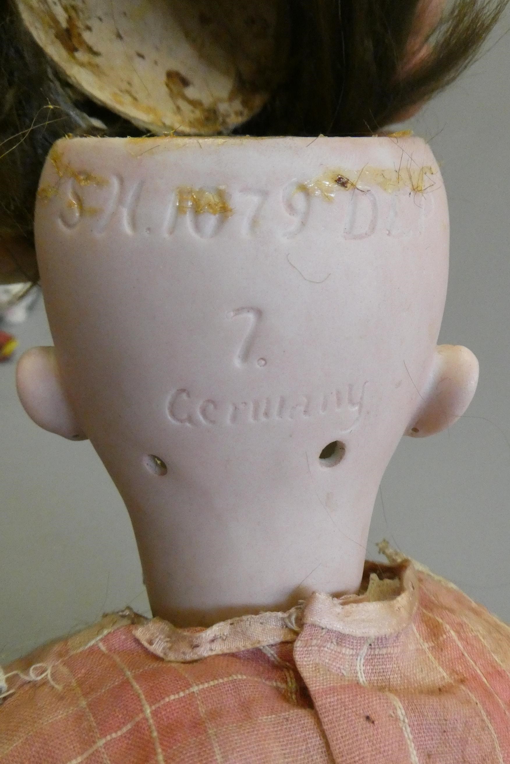 A Simon & Halbig bisque socket head doll with head turning mechanism Image