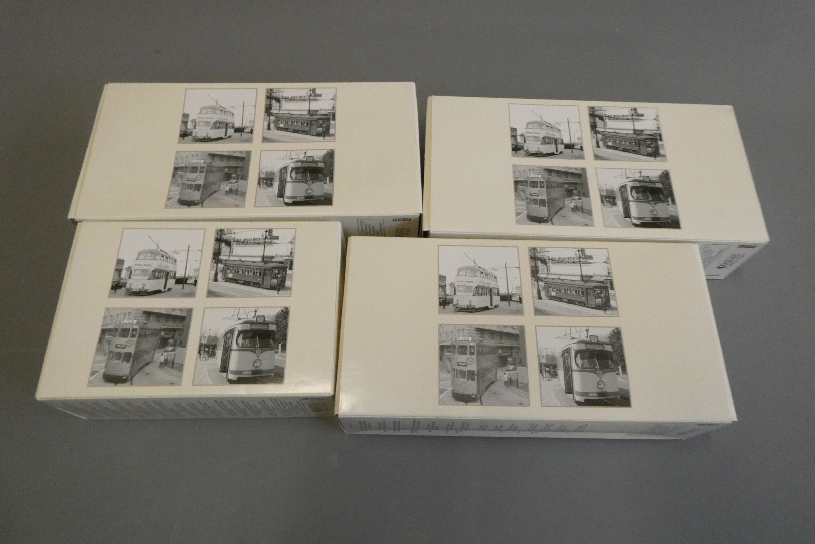 Four Atlas Editions plastic European trams, all items boxed, mint (Est. plus 24% buyer's premium Image