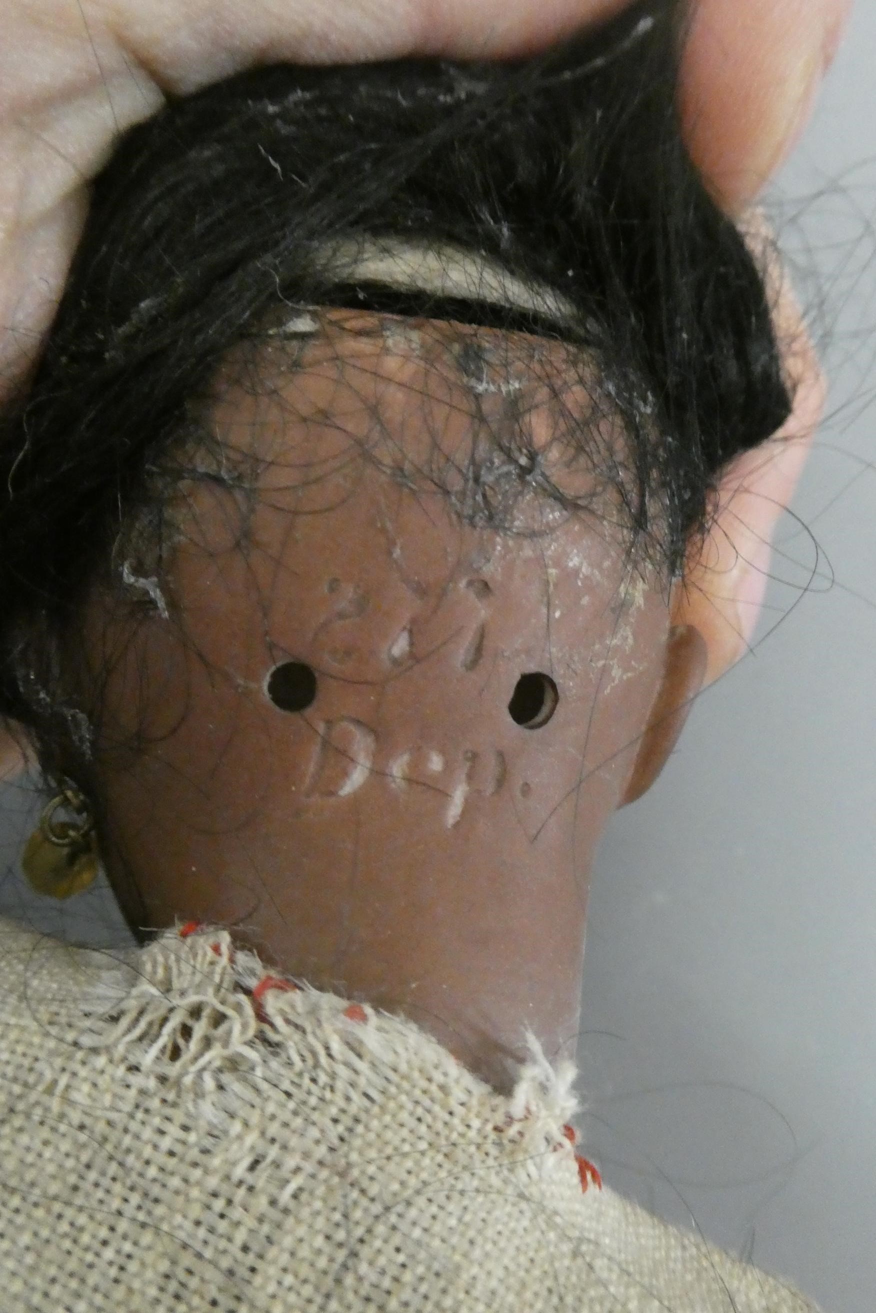 A bisque socket head doll Image