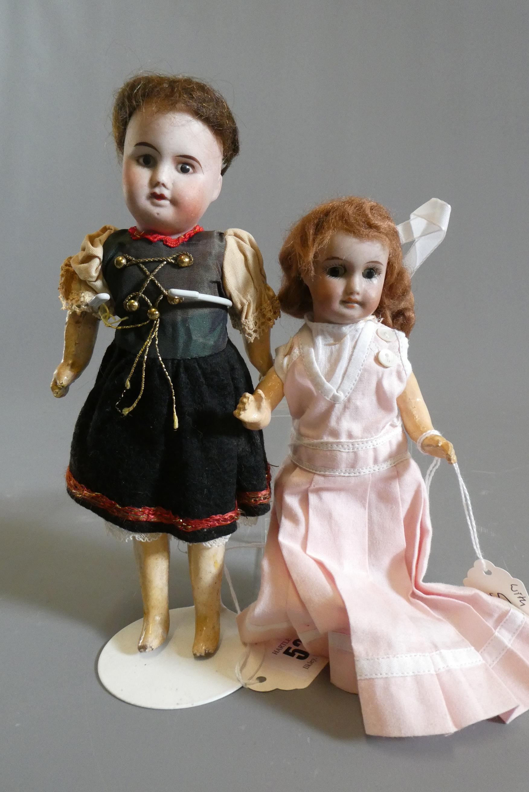 Two small SFBJ bisque socket head dolls Image