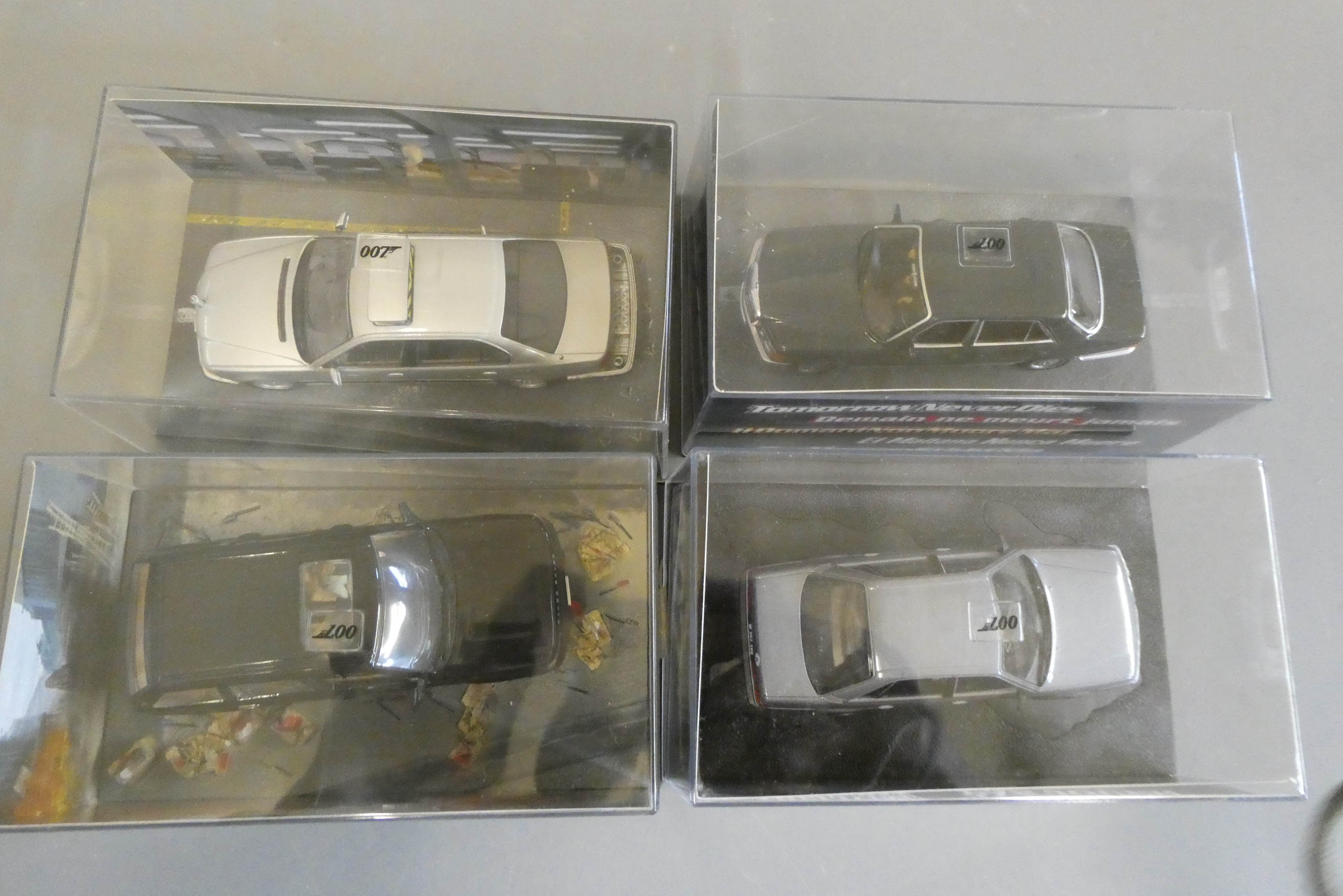 Four Eaglemoss James Bond Tomorrow Never Dies vehicles comprising BMW 750, Range Rover, Mercedes S Image