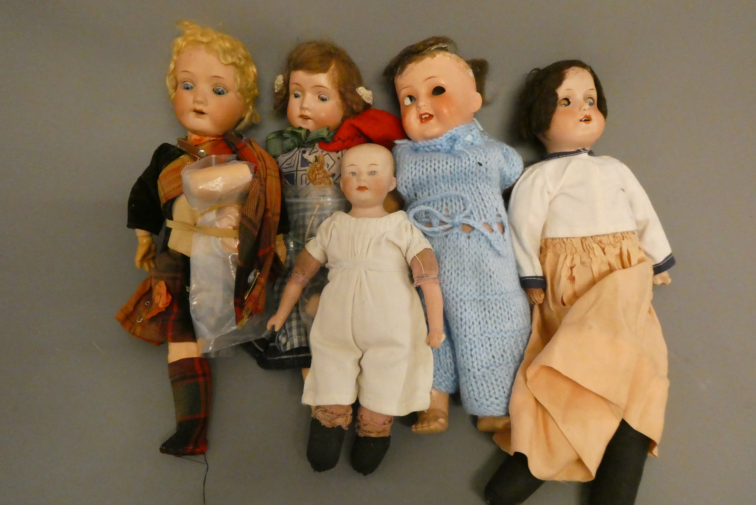 Five bisque head dolls Image
