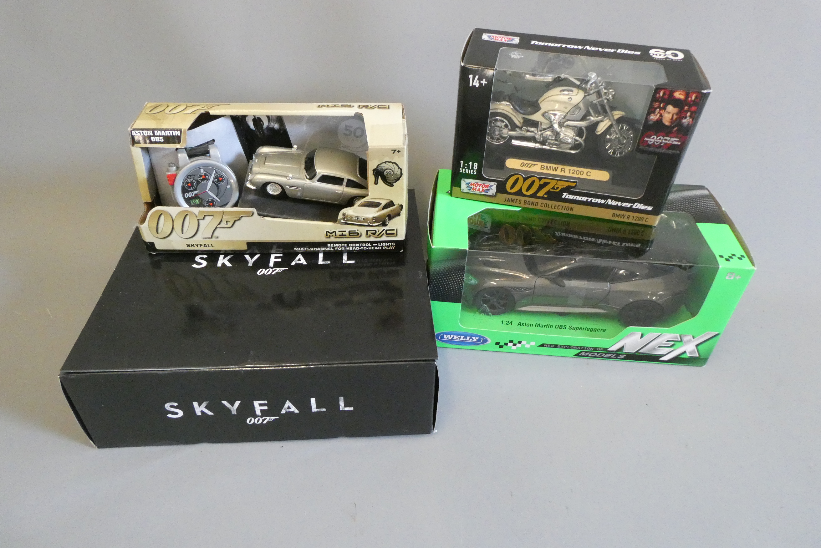 Small radio-controlled Aston Martin DB5, 007 BMW R1200 motorbike, Skyfall Helicopter and NEX Aston Image