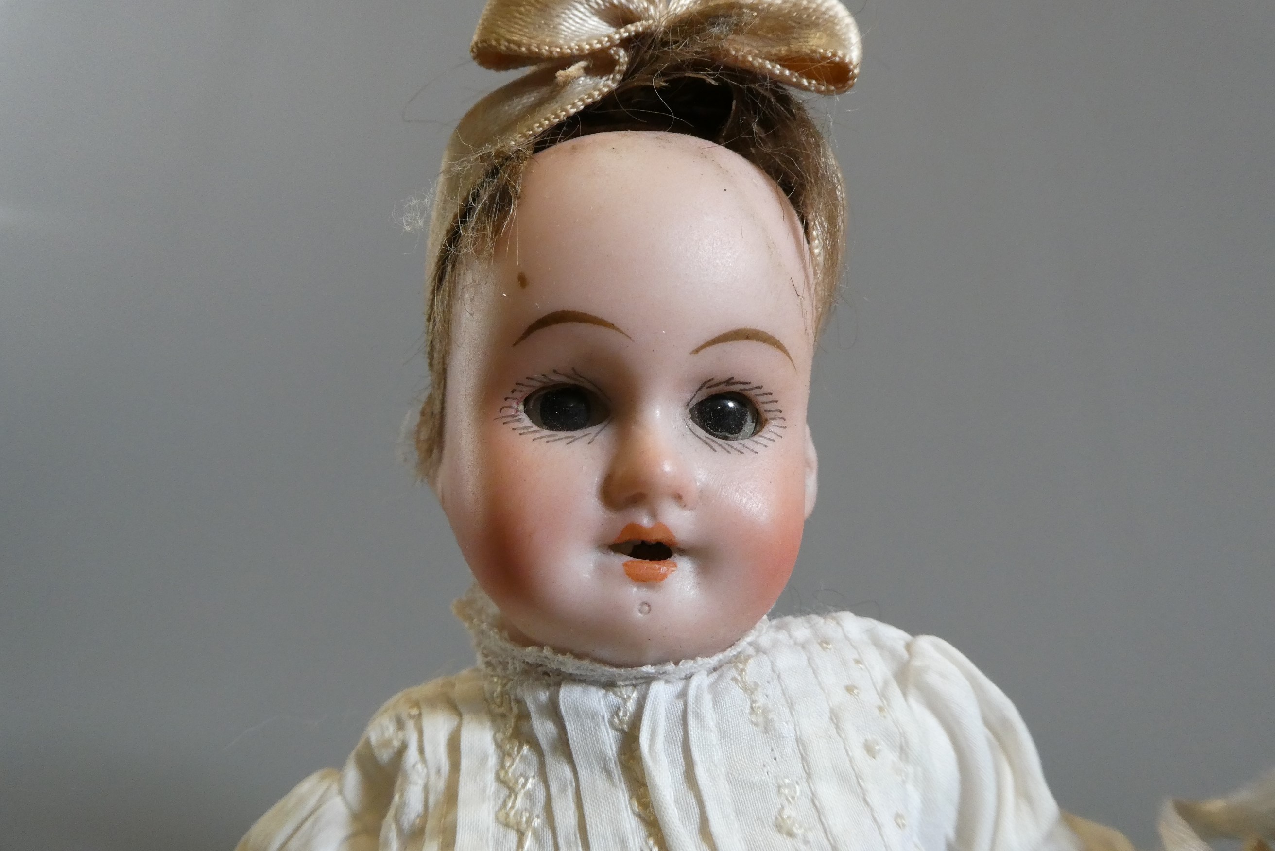 Three small bisque socket head dolls Image