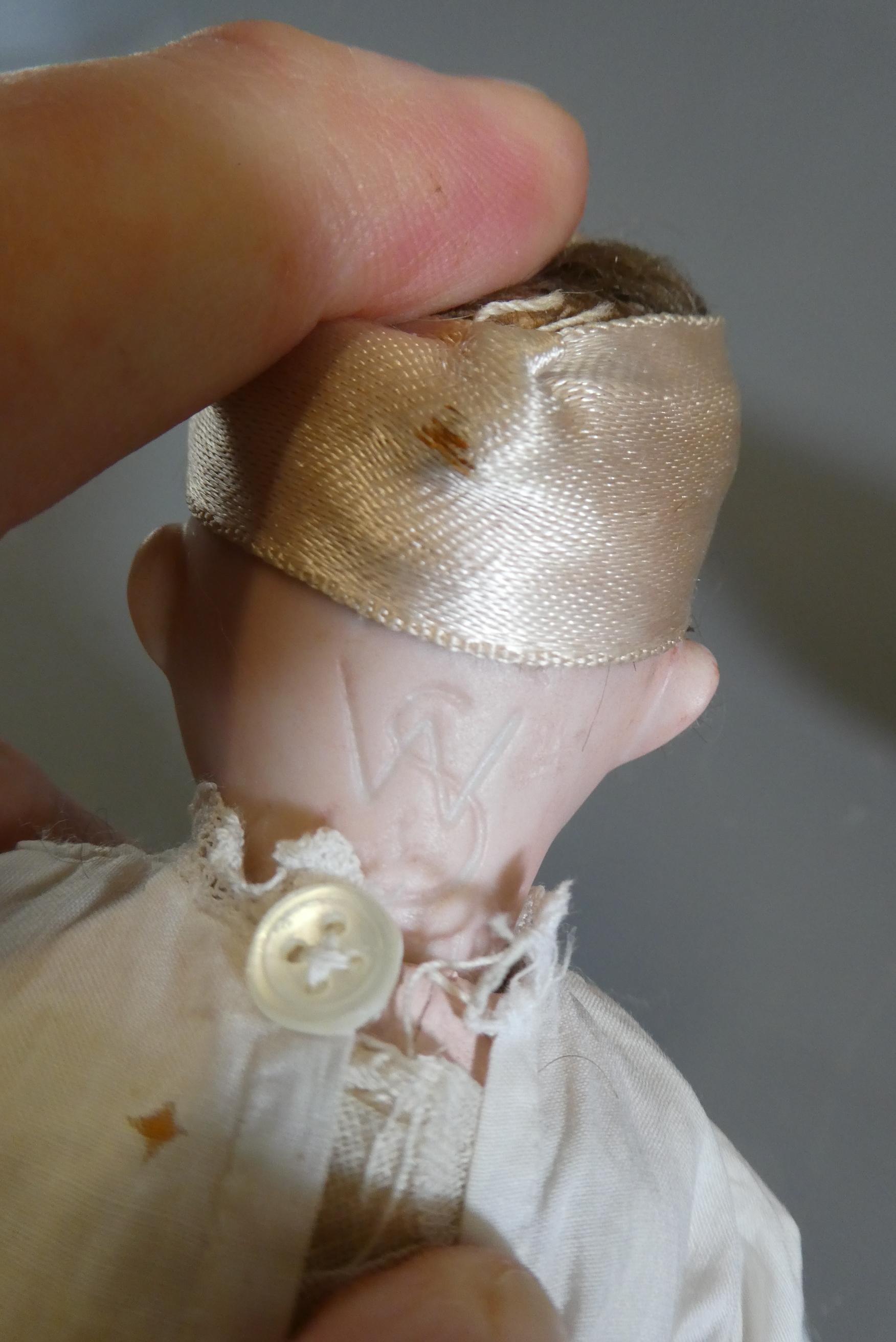 Three small bisque socket head dolls Image