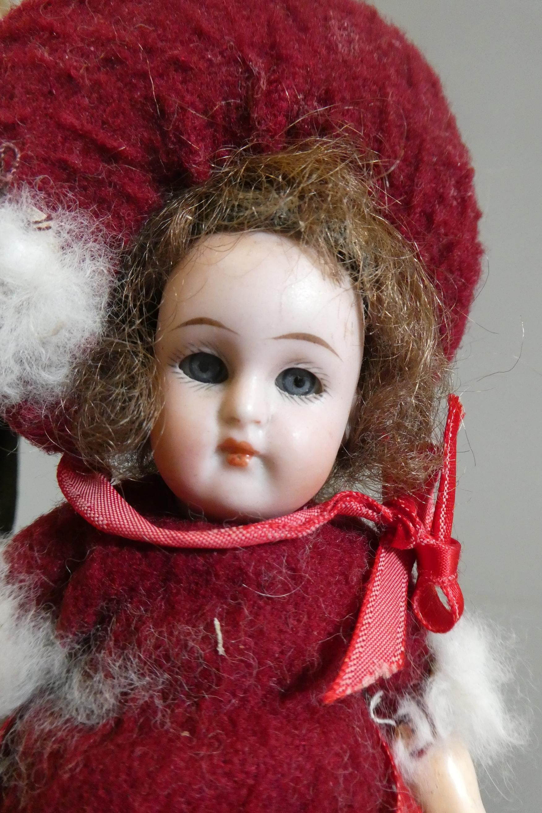 Three small bisque socket head dolls Image