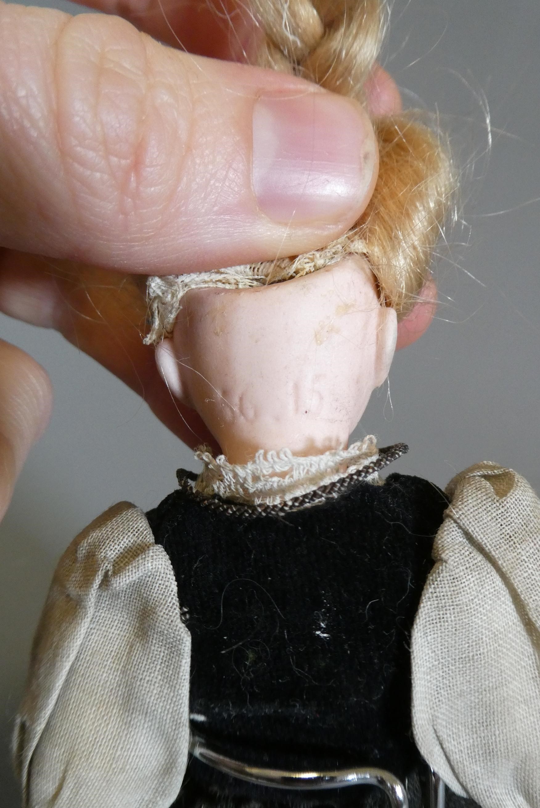 Three small bisque socket head dolls Image