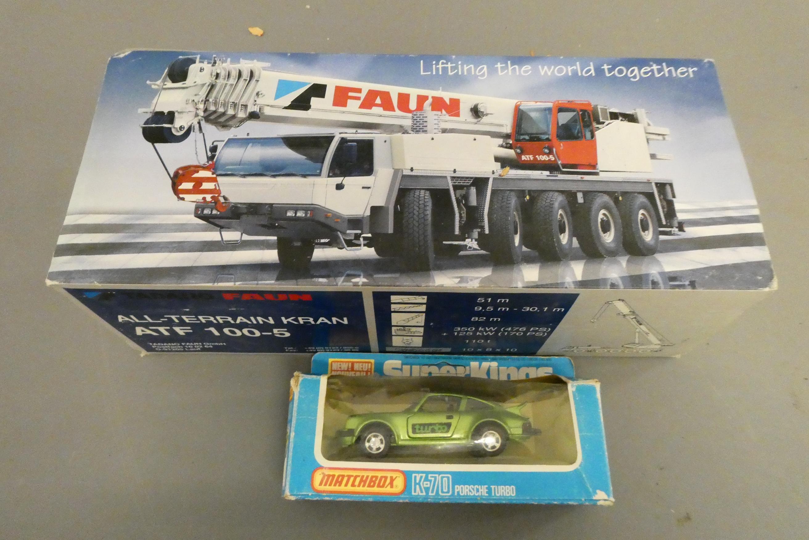 Tadano All Terrain crane truck ATF 100-5, boxed ,good and Matchbox K-70 Porsche, boxed, fair (Est. Image