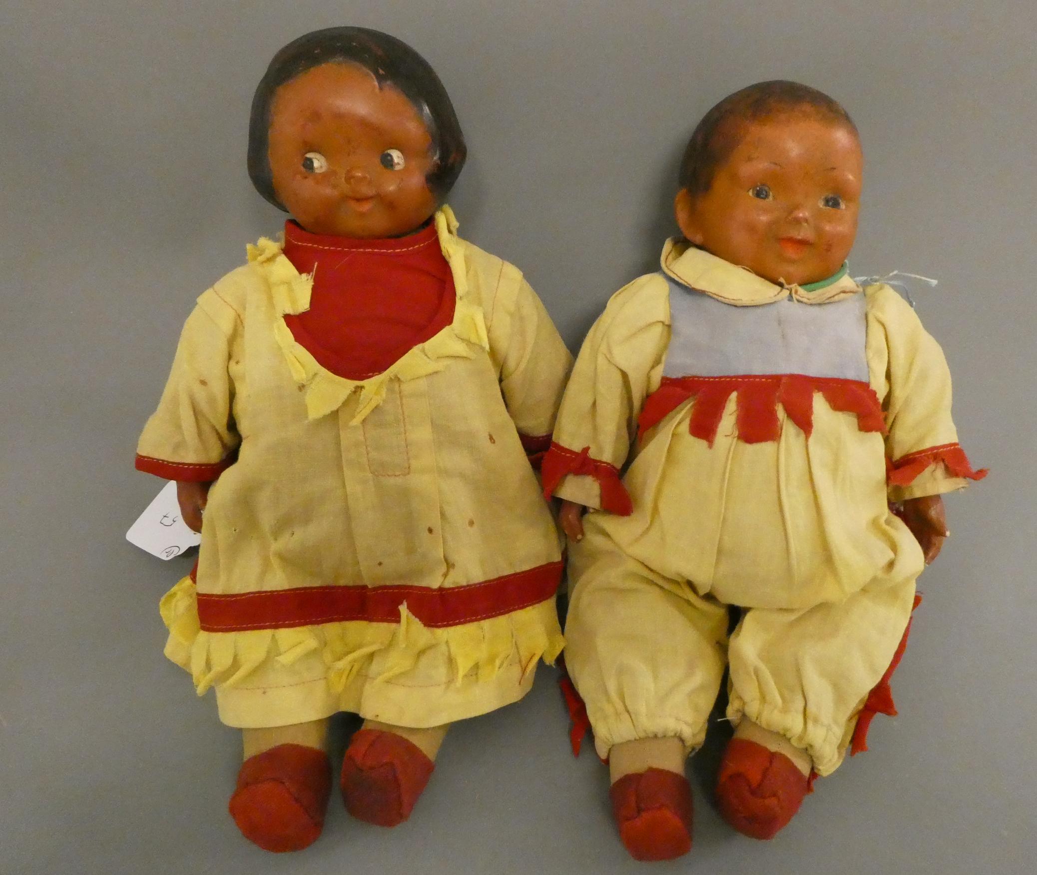 A pair of Campbells kids composition character dolls, c. 1910, with original outfits and cloth Image