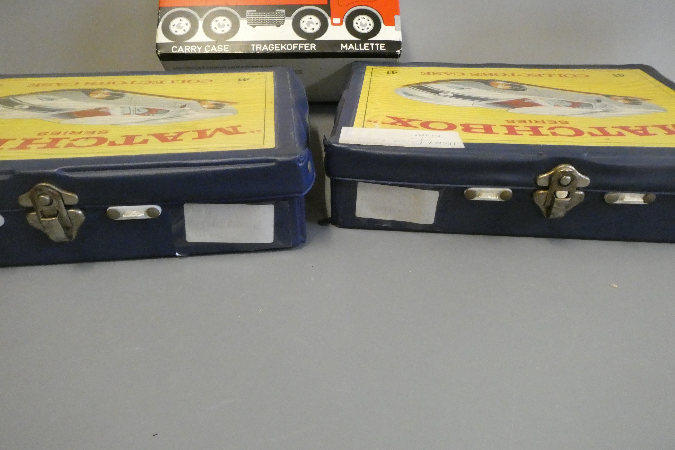 Three Matchbox plastic carry cases with internal trays, carry handles broken/missing and some age Image
