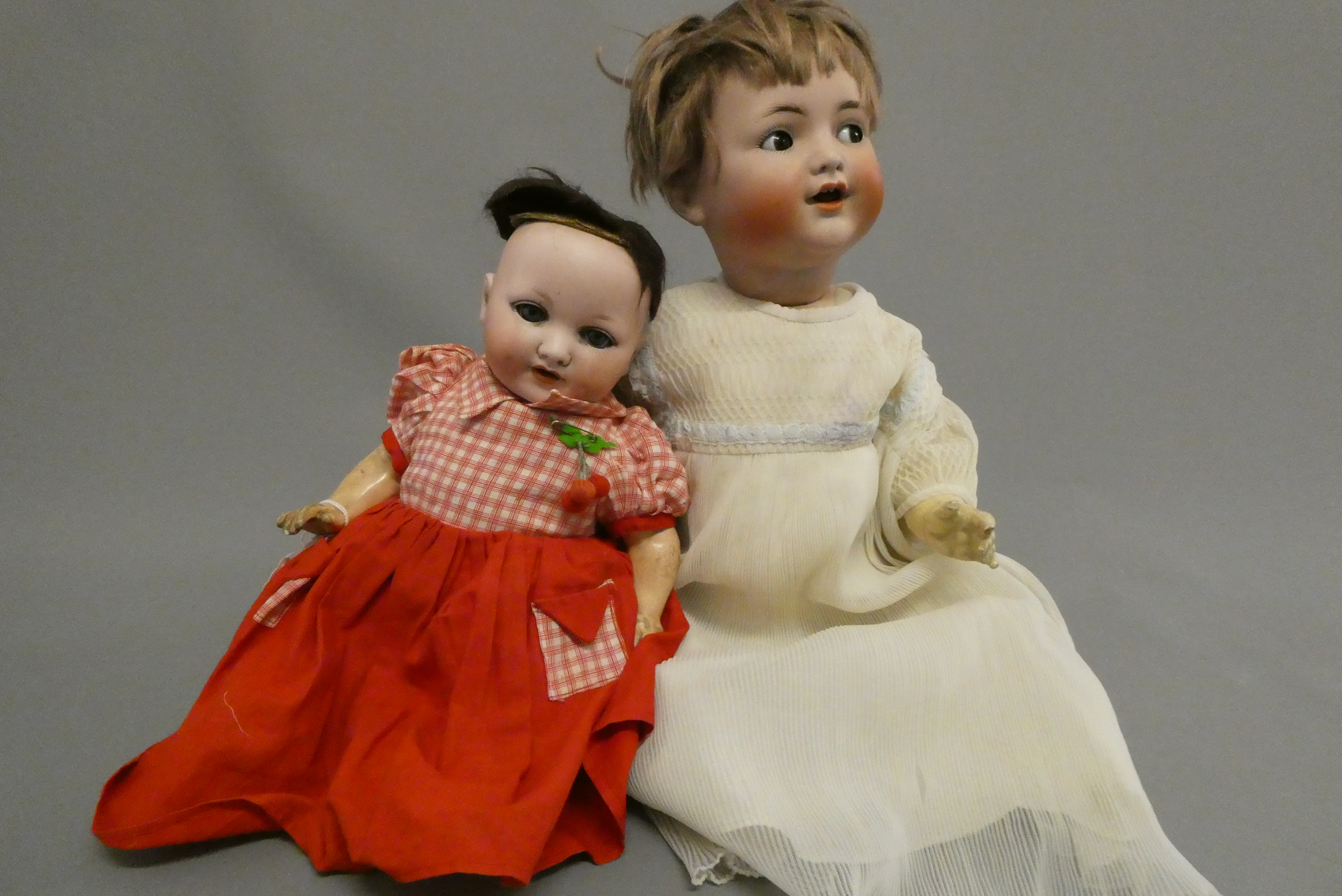Two bisque socket head dolls Image