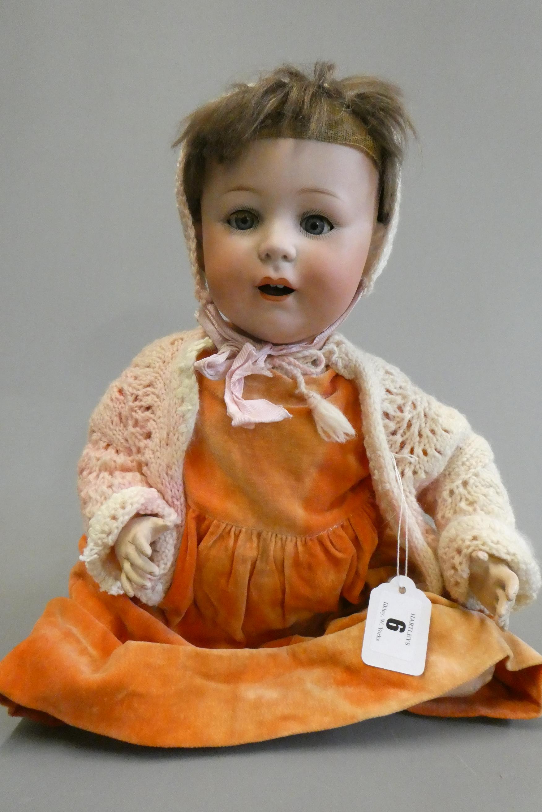 A Jutta bisque socket head doll with blue glass sleeping eyes Image