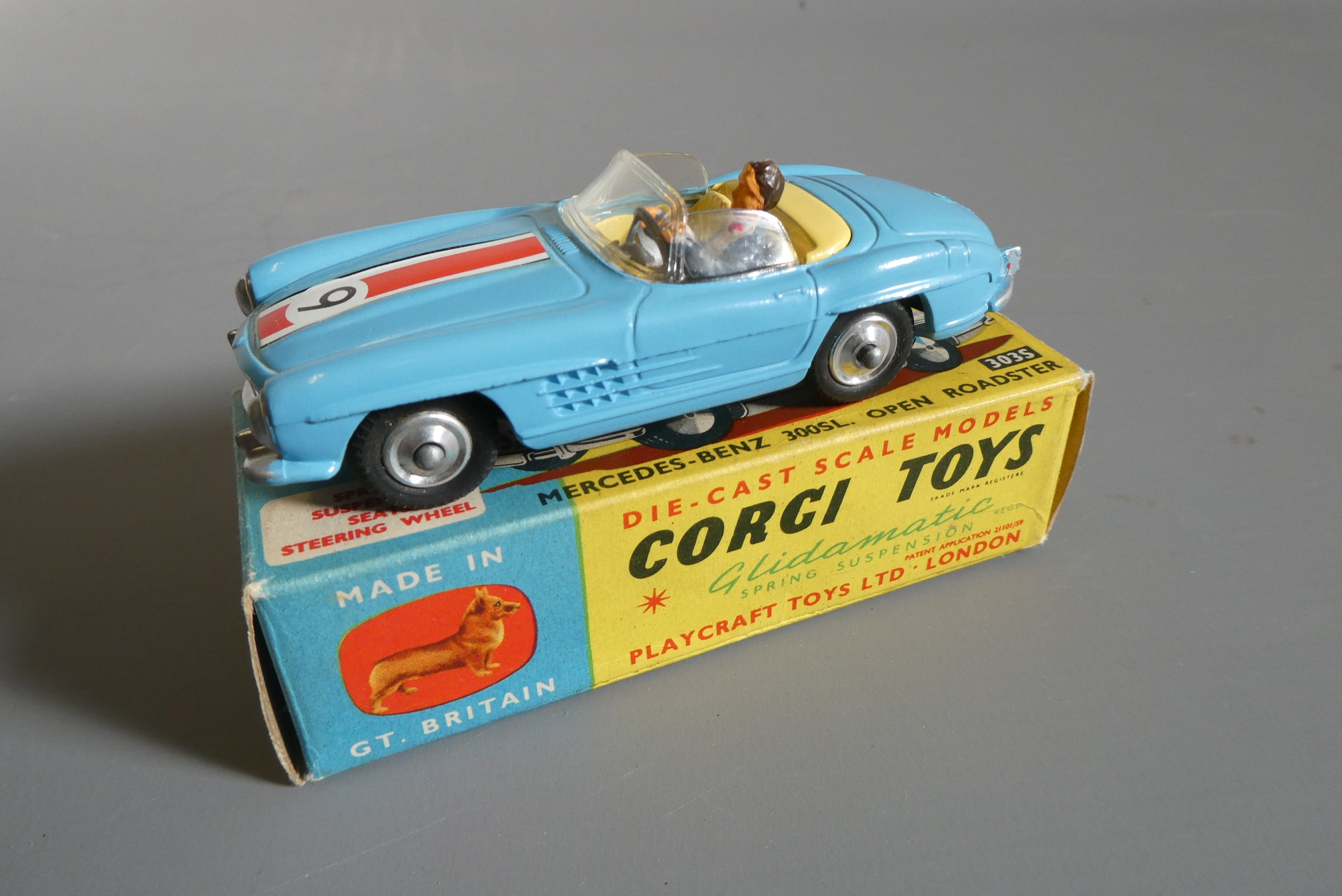 Three Corgi vehicles comprising 156 Cooper race car, 303s Mercedes 300SL and Ferrari 250 LM, boxes Image