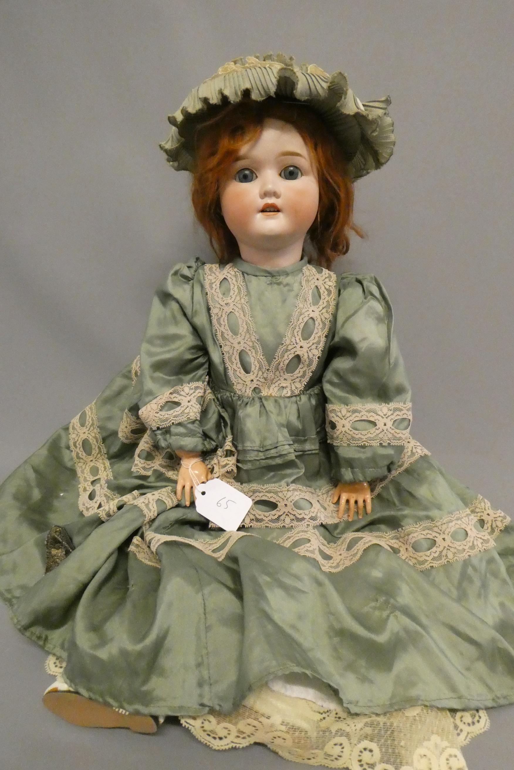 A Schoenau & Hoffmeister bisque socket head doll Image