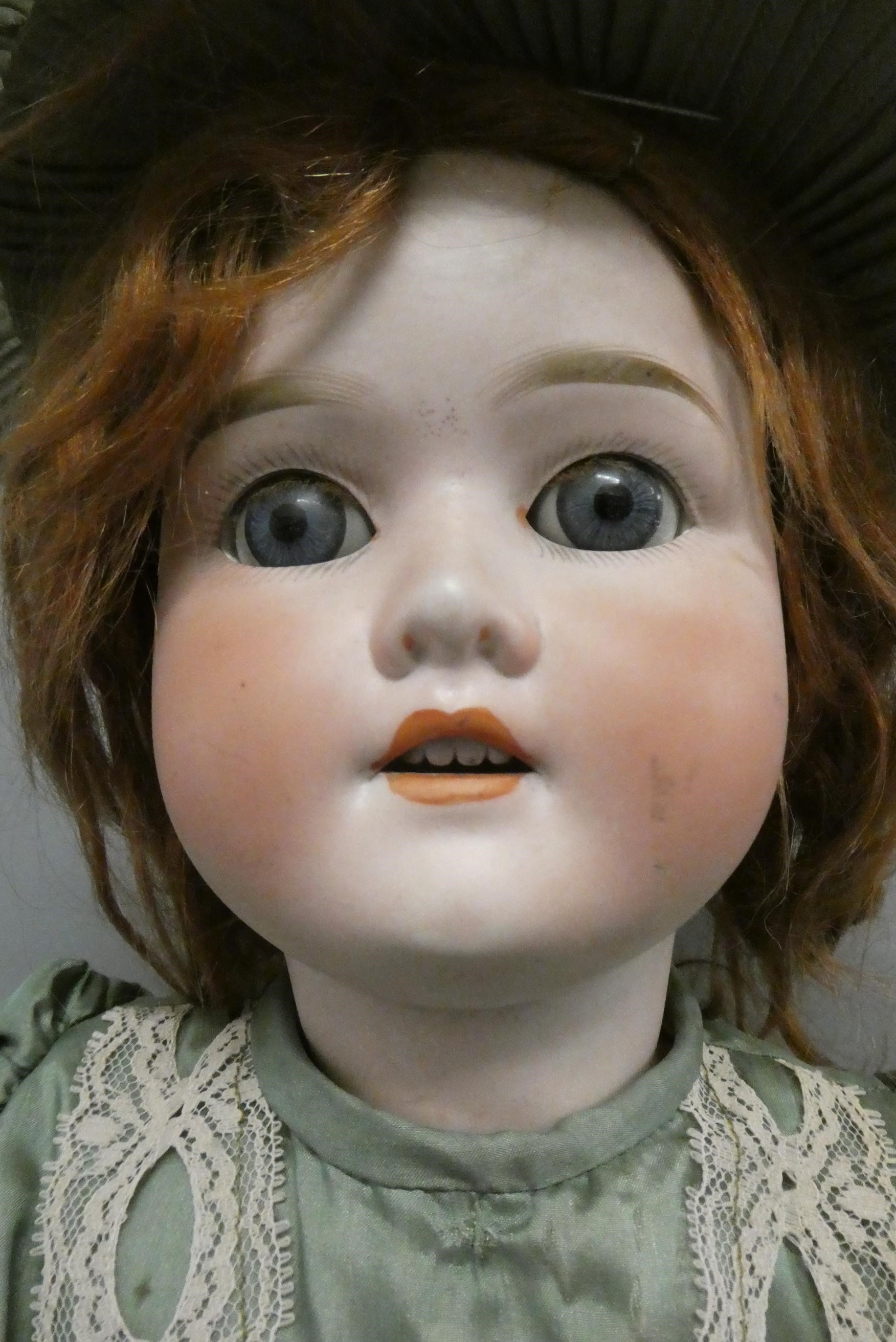 A Schoenau & Hoffmeister bisque socket head doll Image