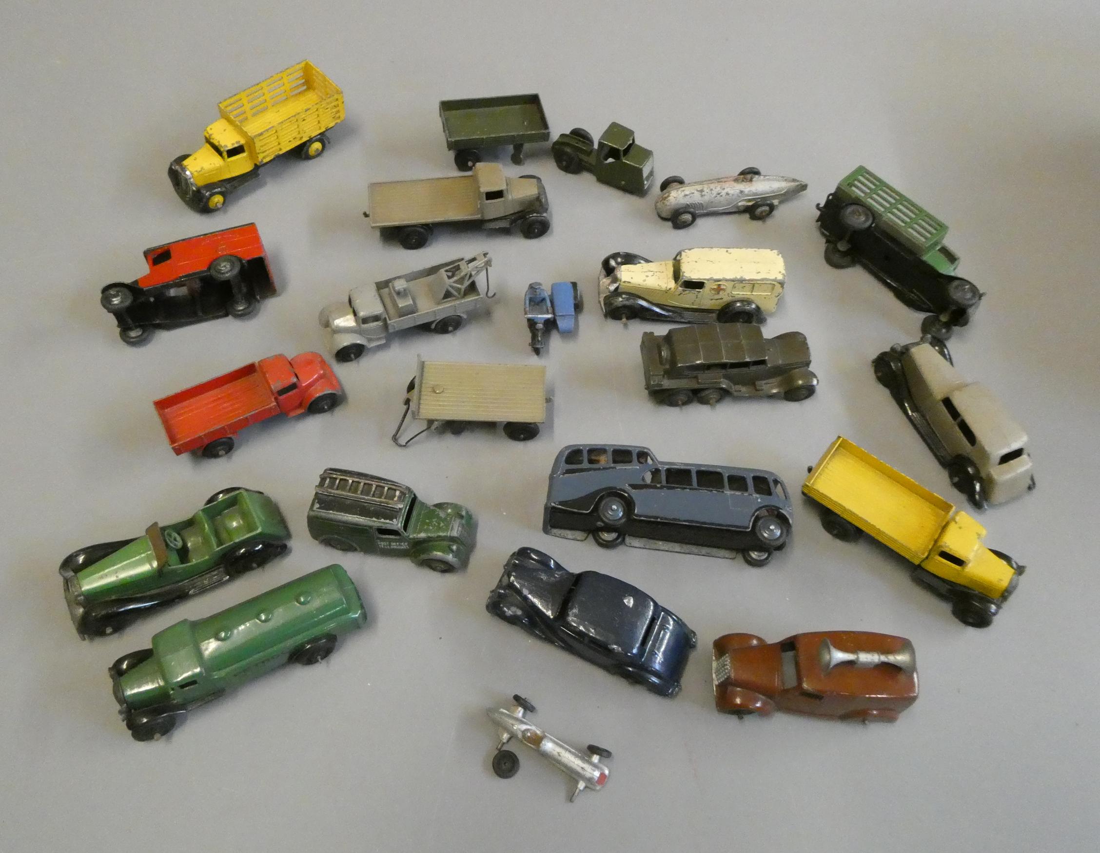Unboxed early Dinky vehicles including saloon cars, vans, trucks and some military vehicles, most Image