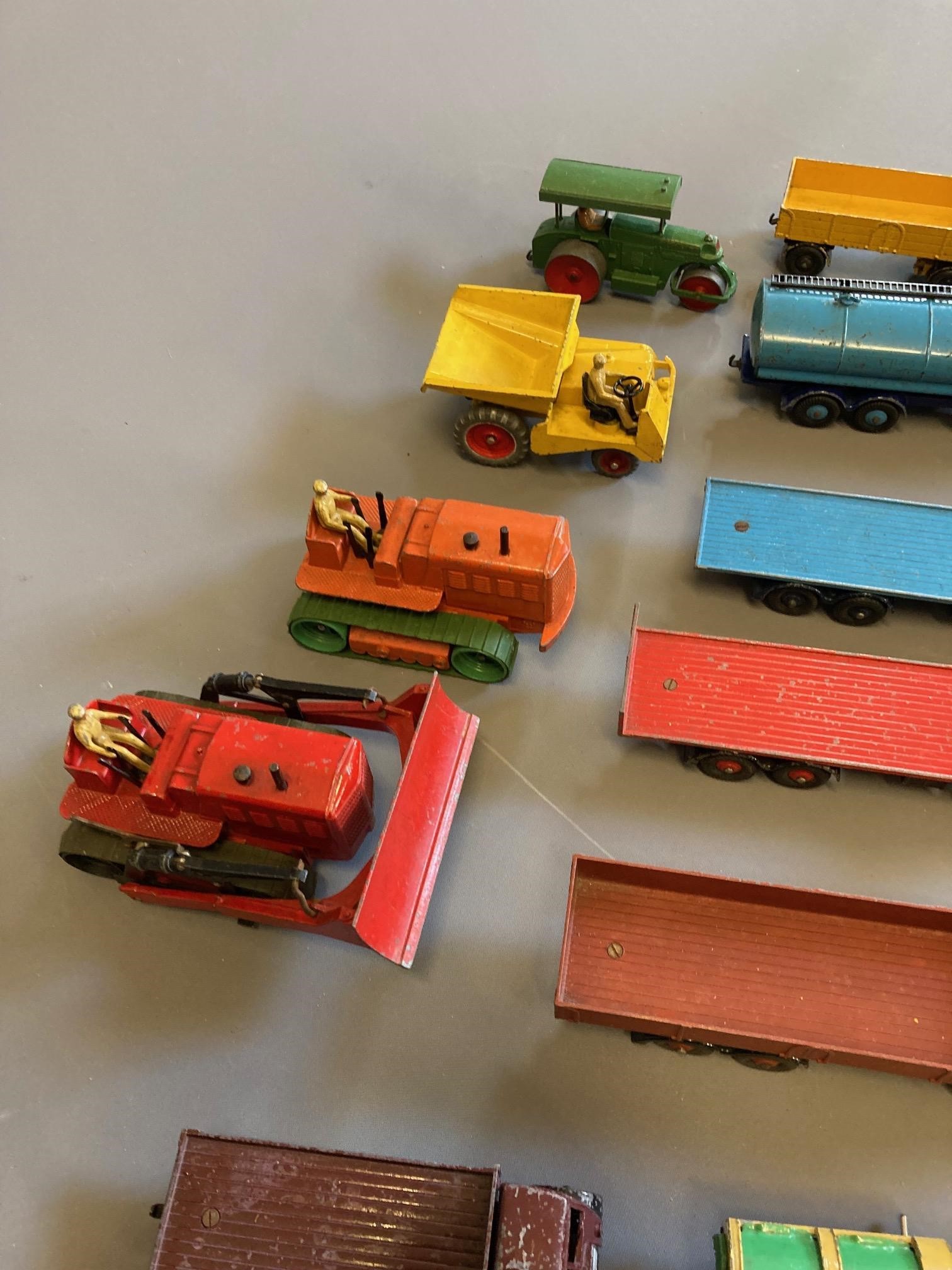 Unboxed Dinky commercial vehicles including Foden flatbed lorries and tracked vehicles, most items Image