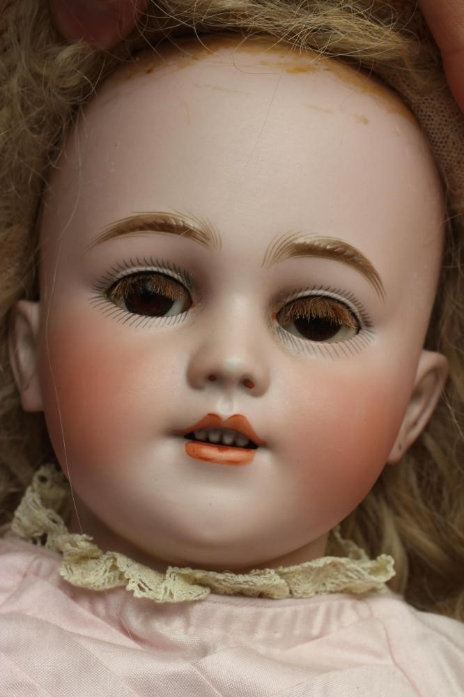 A Simon & Halbig bisque socket head doll Image