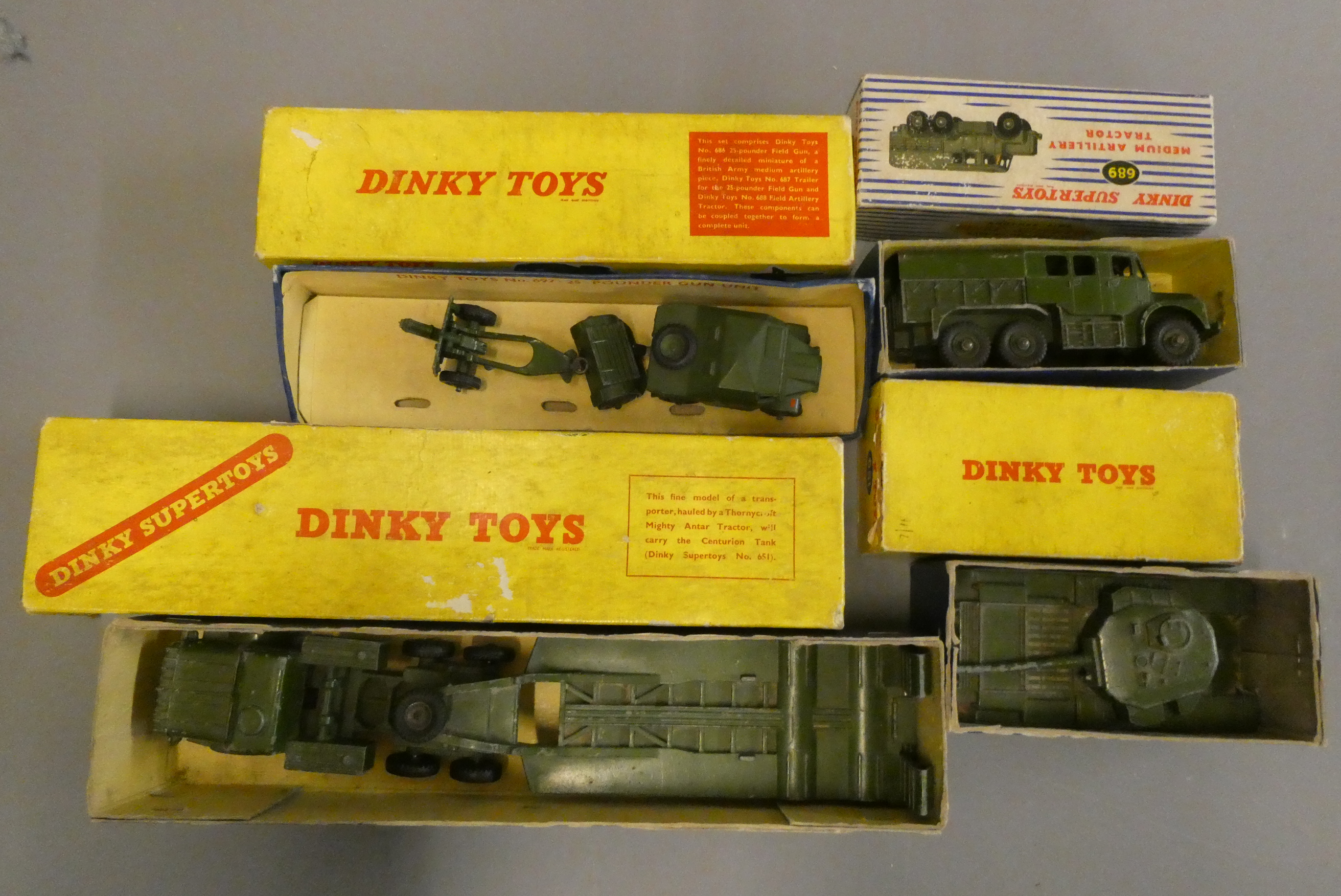 Playworn Dinky army trucks comprising Tank Transporter, Tank Medium Artillery Tractor and Field Gun Image