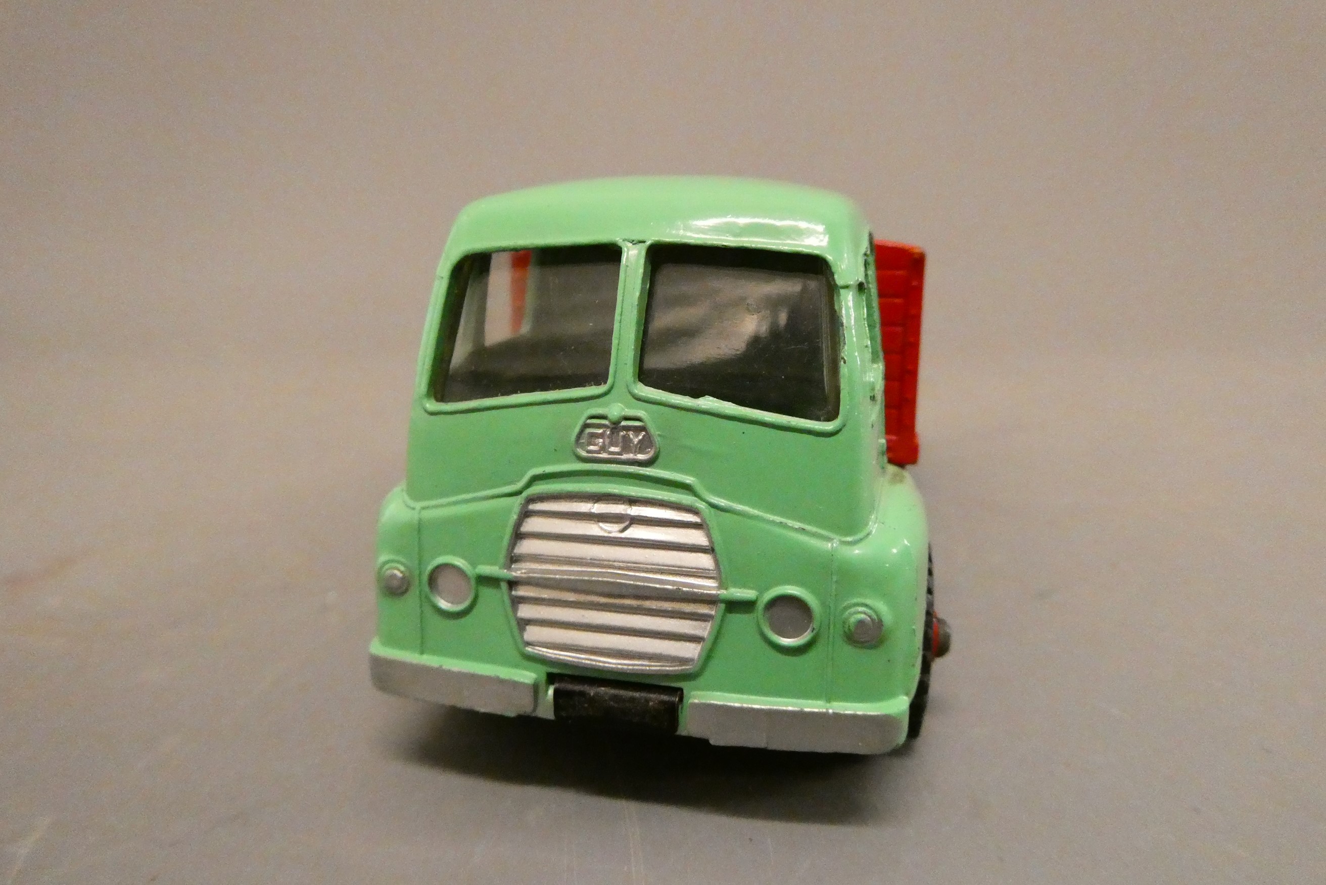 Dinky 512 Guy flat truck finished in red and green with windows, good to excellent (Est. plus 24% Image