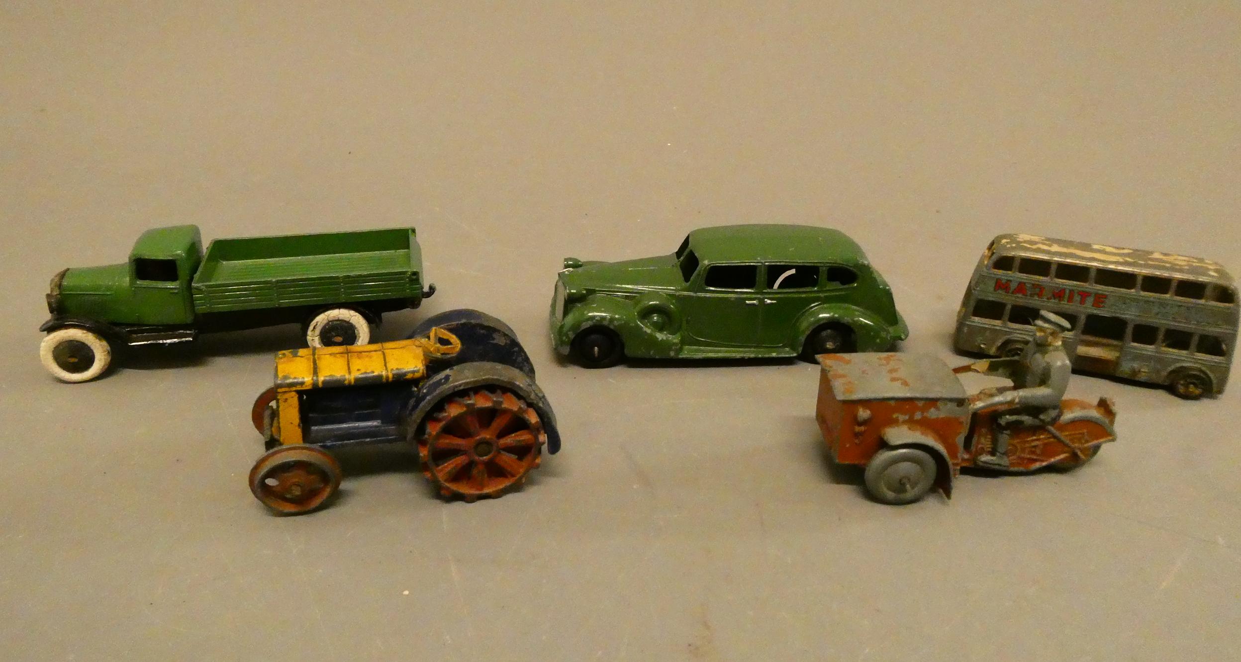 Dinky Tri-Porter motorcycle, tipping truck, pre-war tractor, Packard saloon and Marmite bus, fair to Image