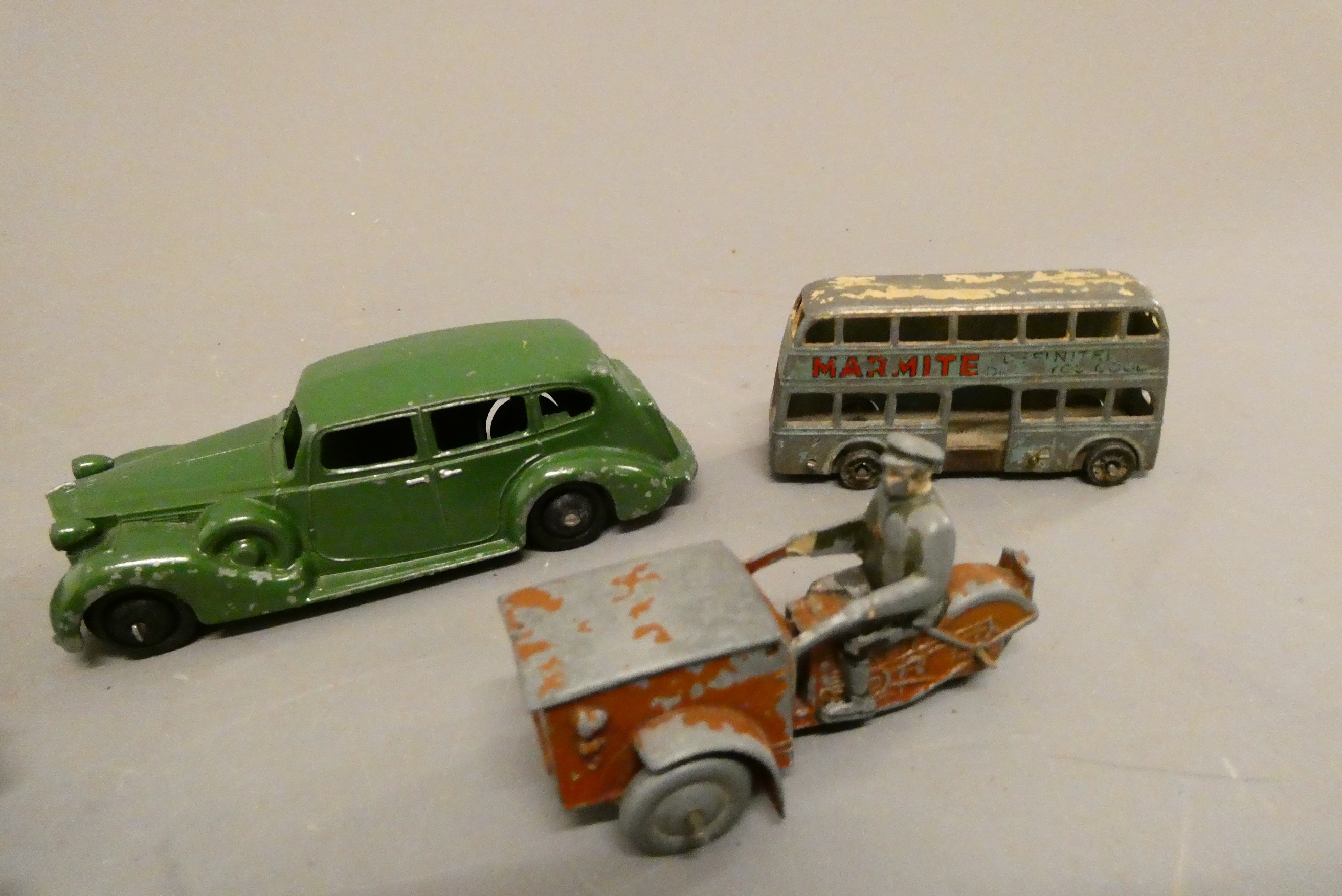Dinky Tri-Porter motorcycle, tipping truck, pre-war tractor, Packard saloon and Marmite bus, fair to Image