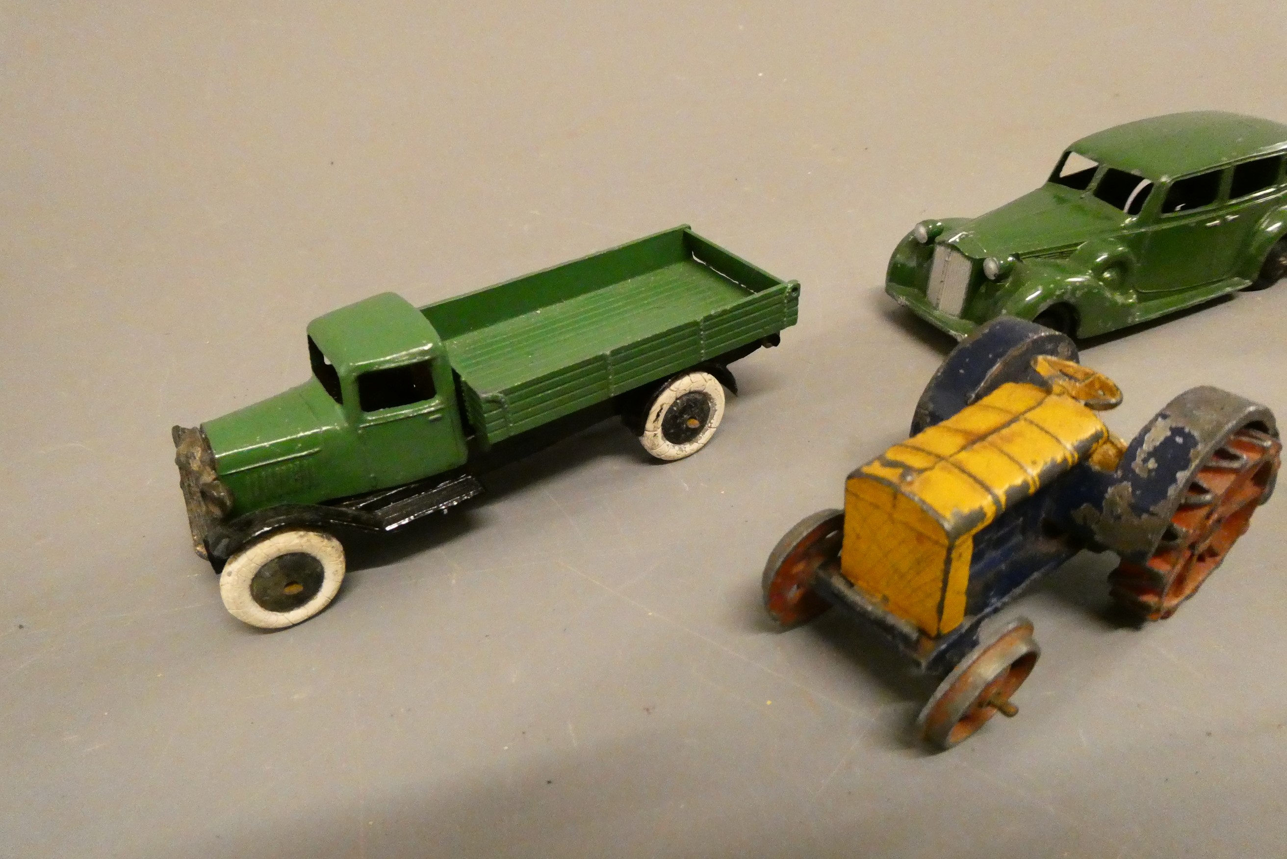 Dinky Tri-Porter motorcycle, tipping truck, pre-war tractor, Packard saloon and Marmite bus, fair to Image