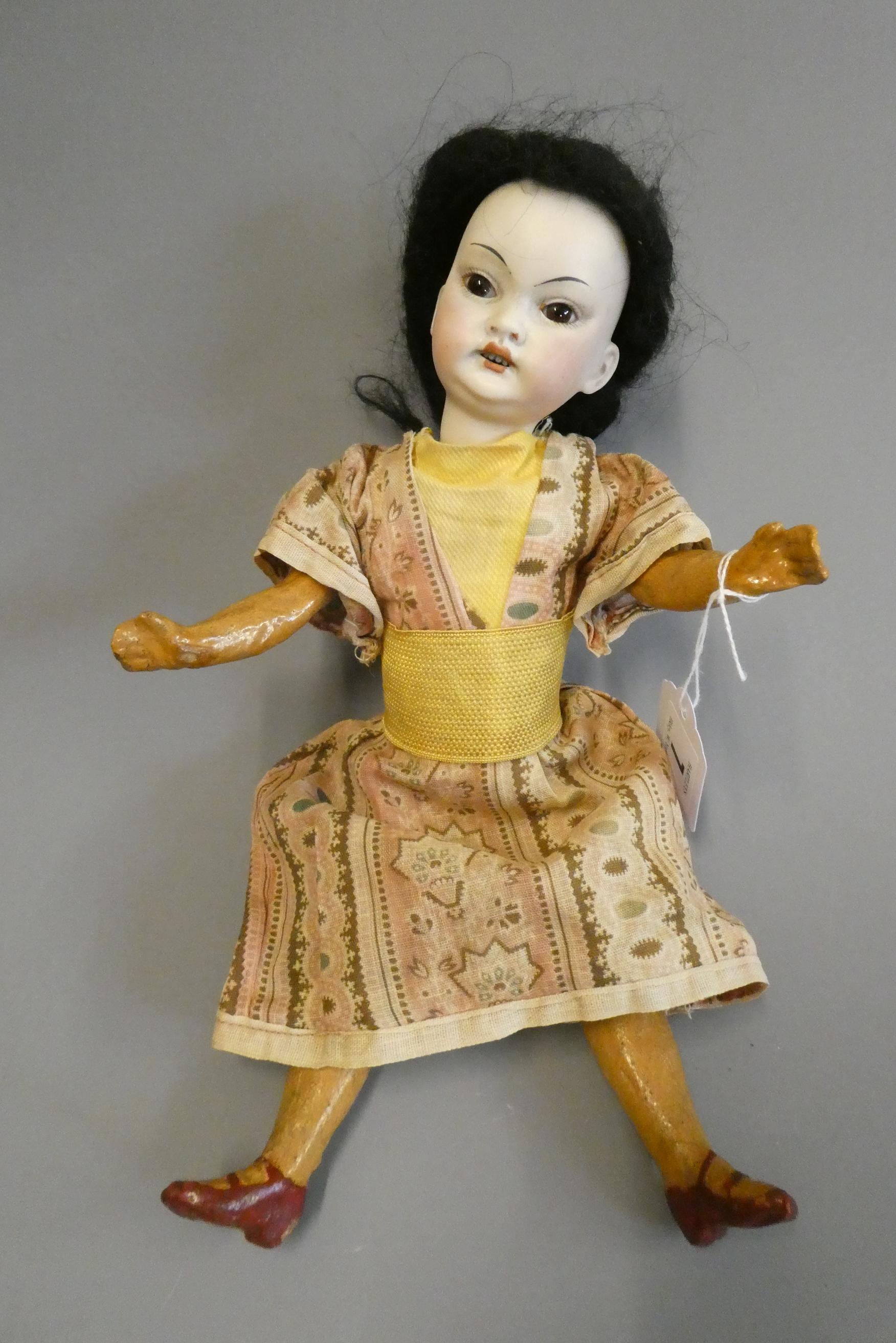 A rare Armand Marseille Japanese socket head doll with brown glass fixed eyes Image