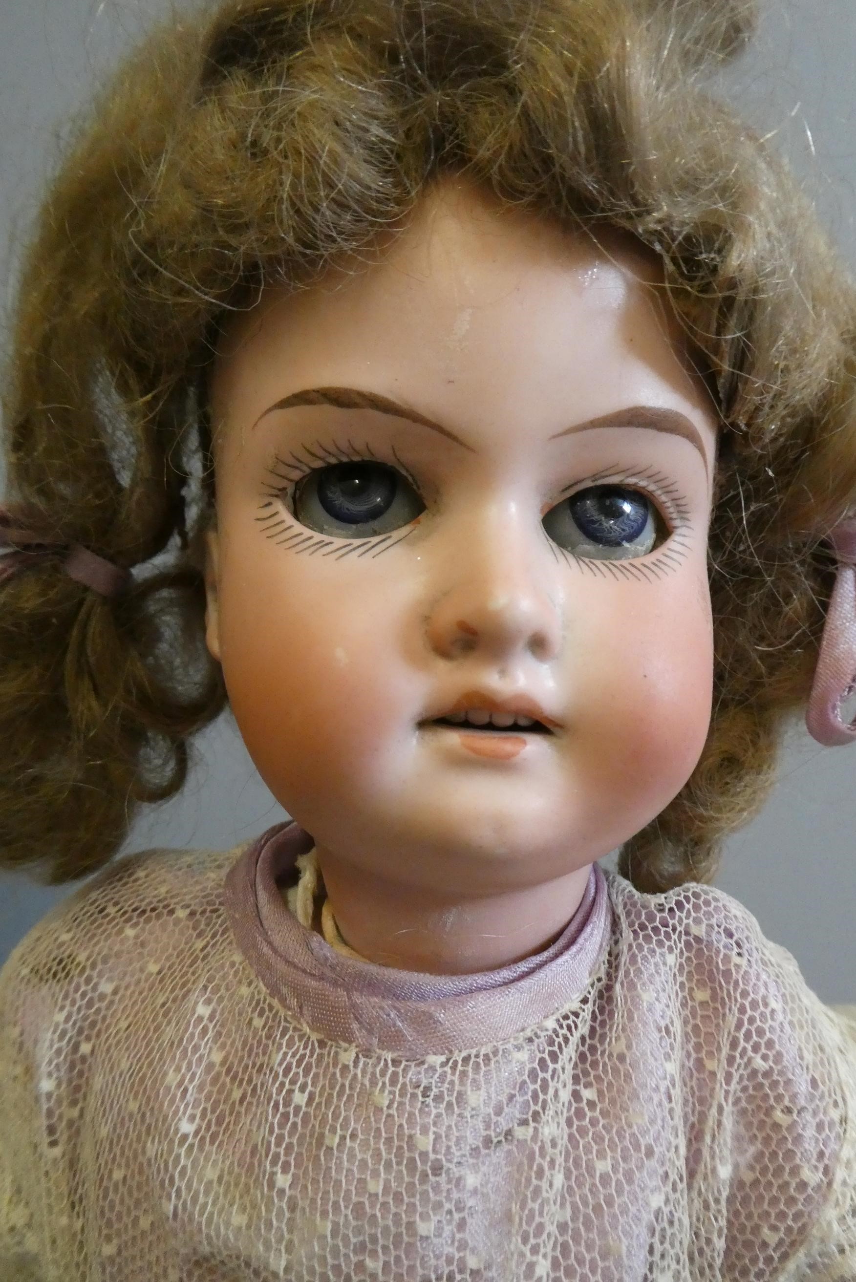 Three bisque socket head dolls Image
