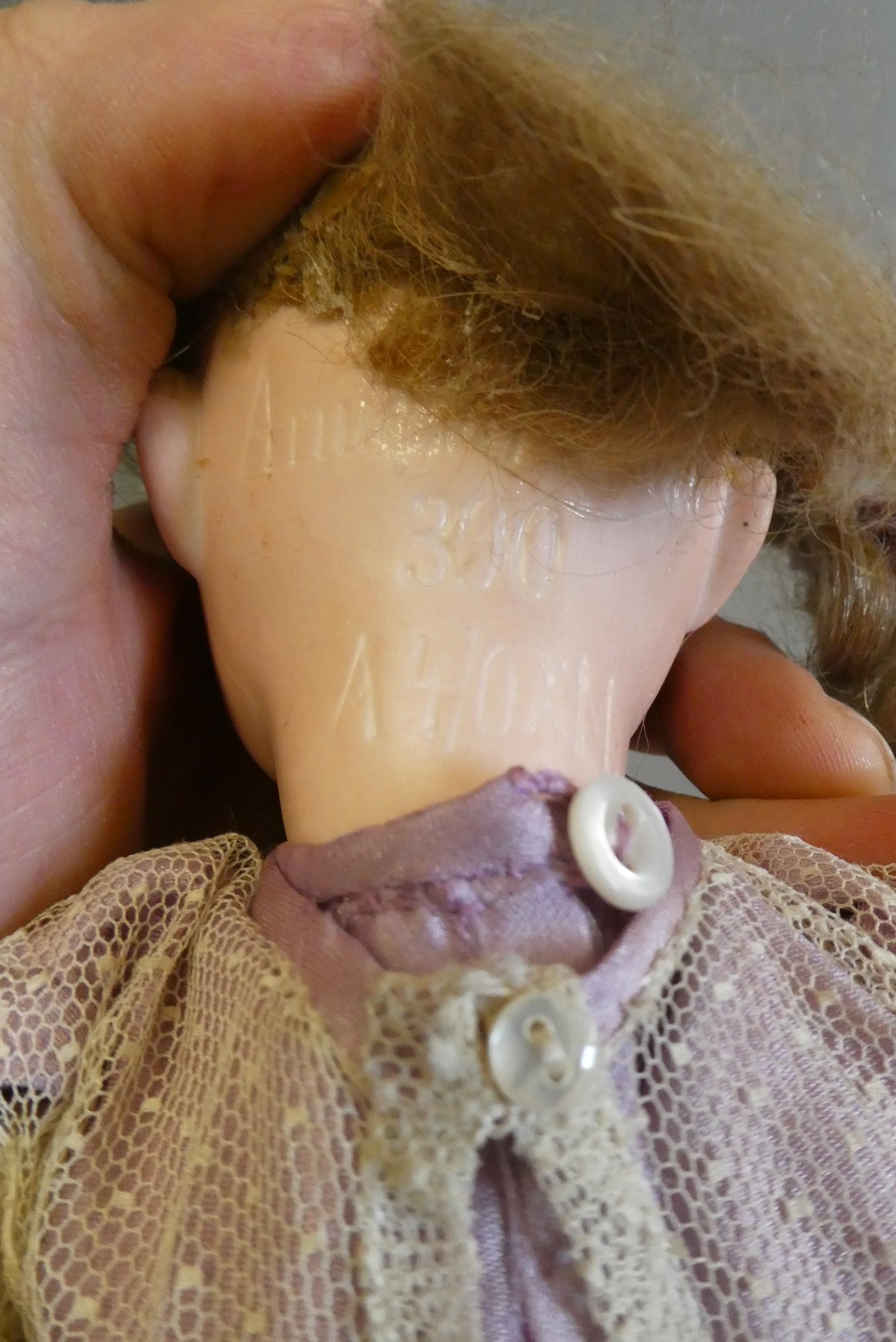 Three bisque socket head dolls Image