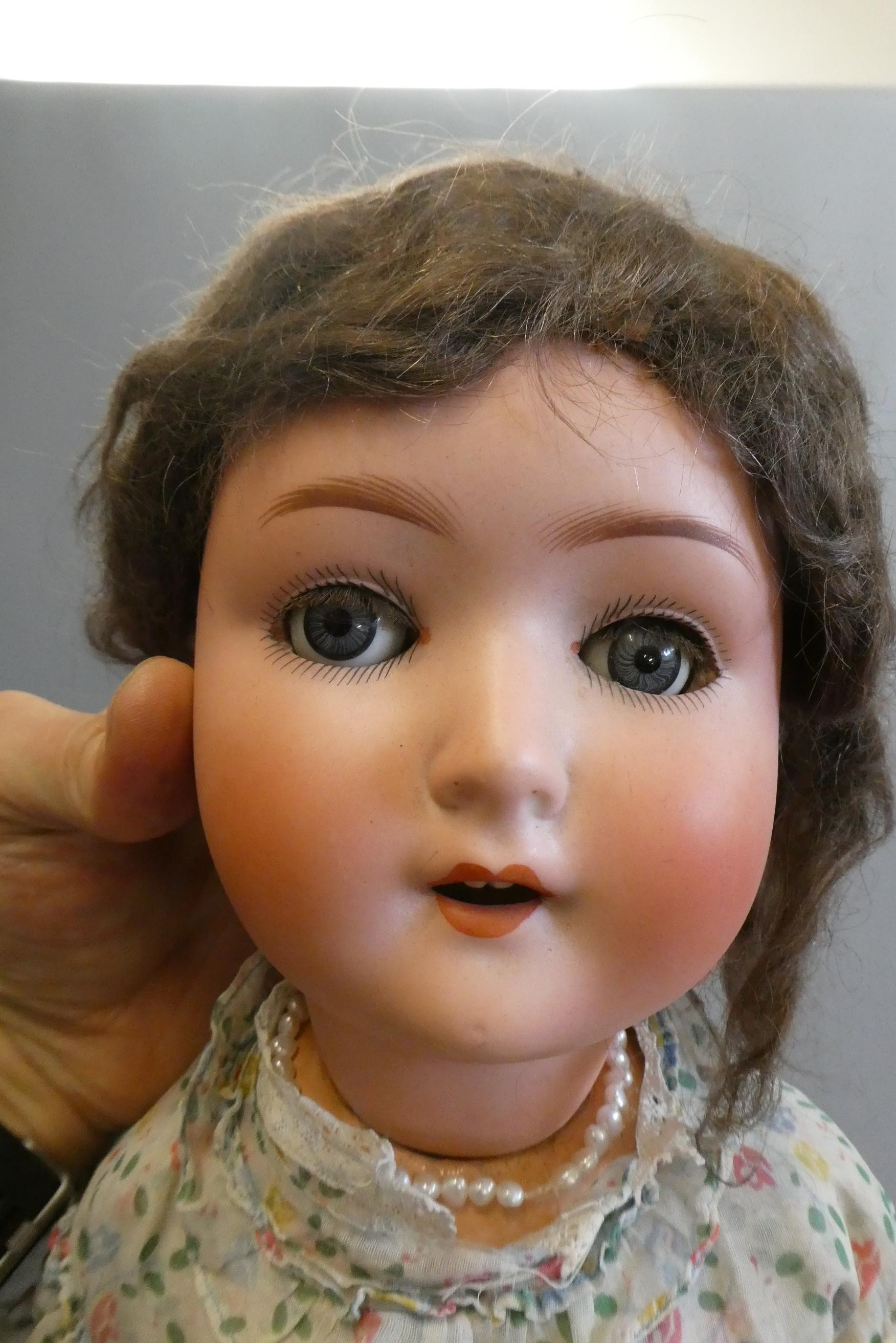 Three bisque socket head dolls Image