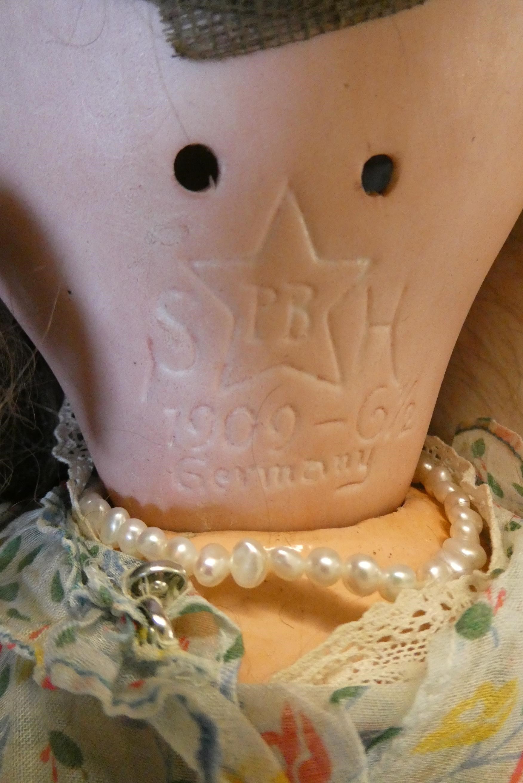 Three bisque socket head dolls Image
