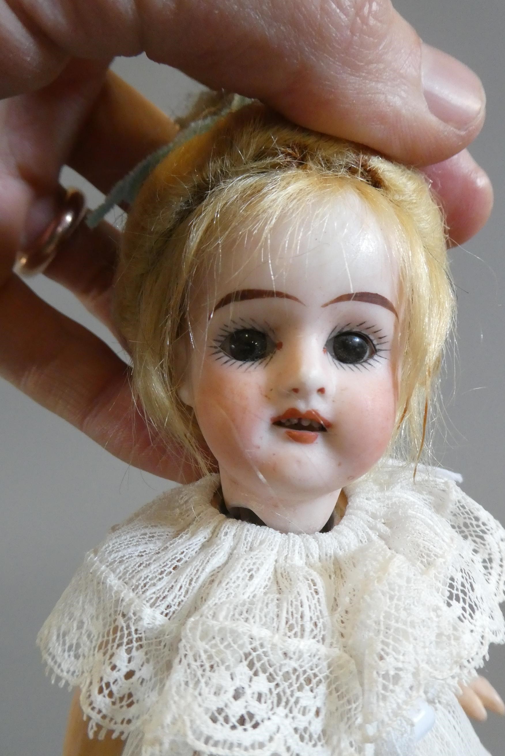Three bisque socket head dolls Image