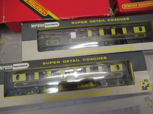 Two Wrenn Pullman coaches, five Hornby wagons, small quantity of Hornby points and sales catalogues. Image