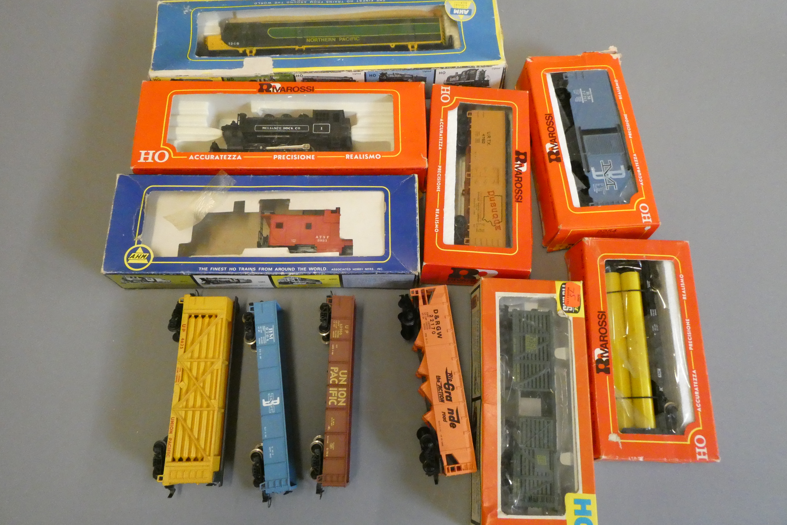 American HO scale trains by Rivarossi and AHM comprising 0-6-0 tank locomotive Reliance Rock Co. Image