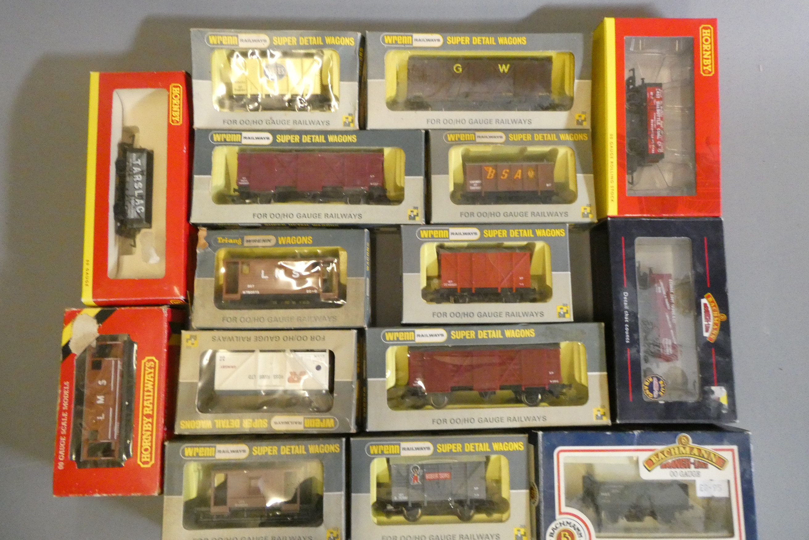 A quantity of boxed and unboxed goods wagons by Wrenn and others including covered vans and coal Image