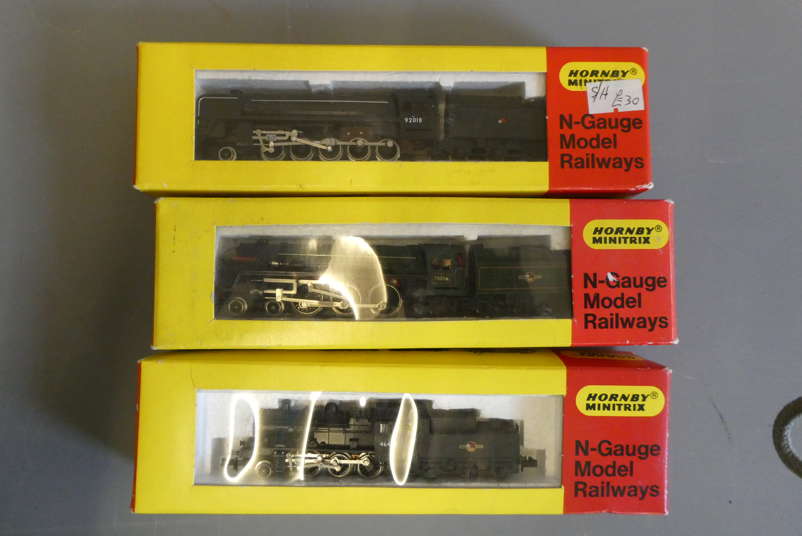 Three Minitrix N gauge locomotives comprising BR black 9F, BR green Britannia and BR black Class 4, Image