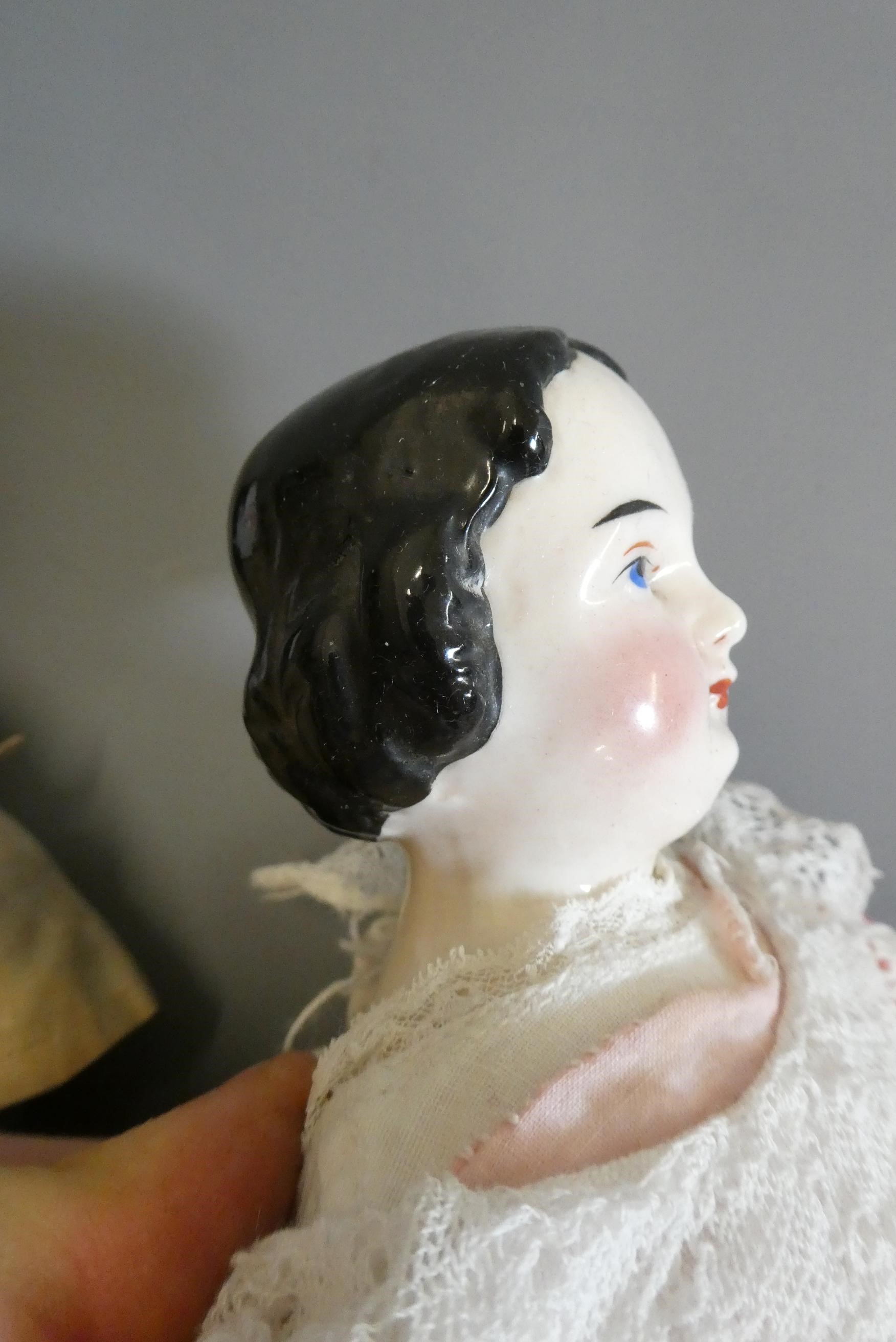 Two Victorian china shoulder head doll's, with painted faces, moulded hair, fabric bodies, china Image