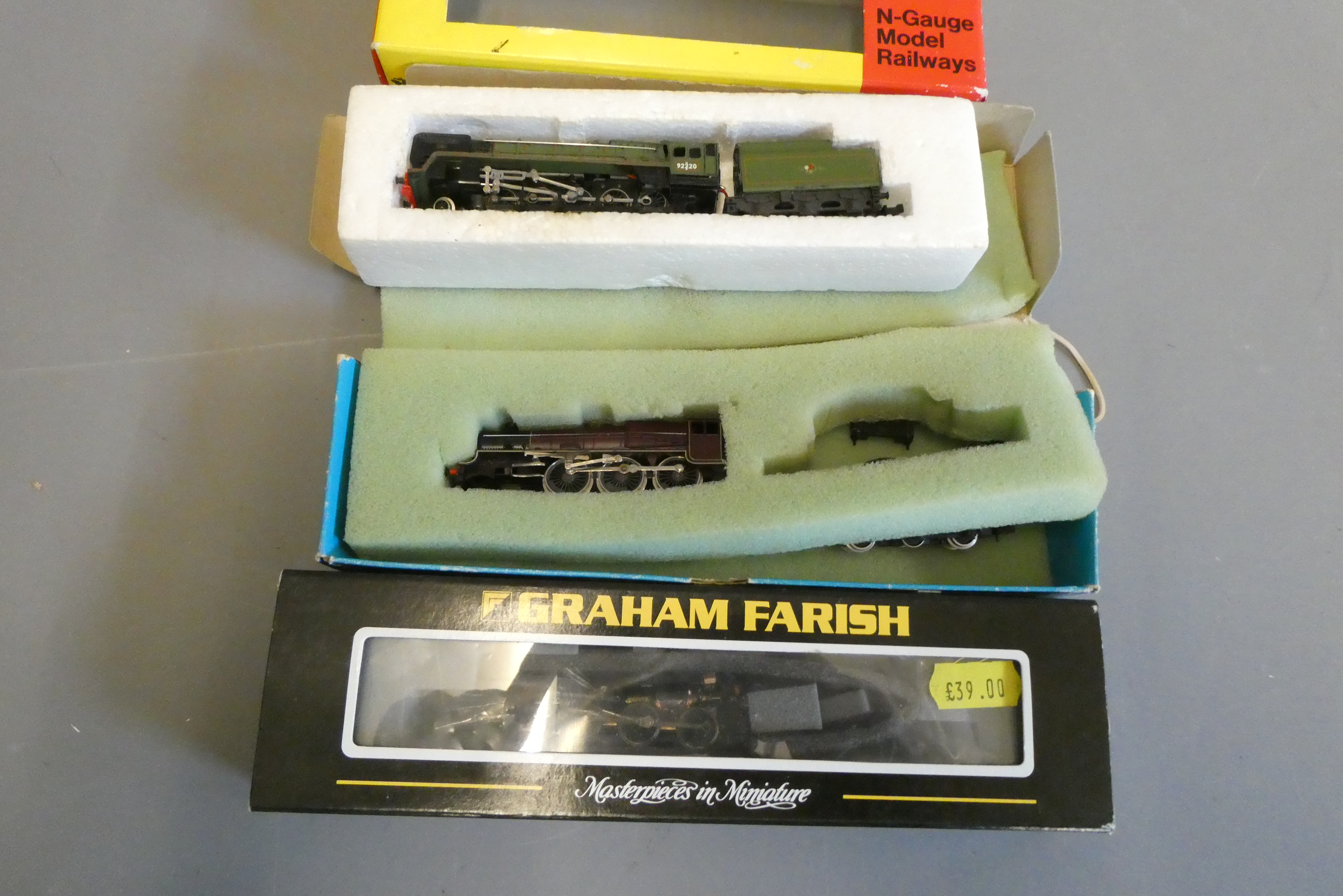 Three damaged N gauge locomotives including Britannia, Peco Jubilee and Graham Farish chassis (Est. Image