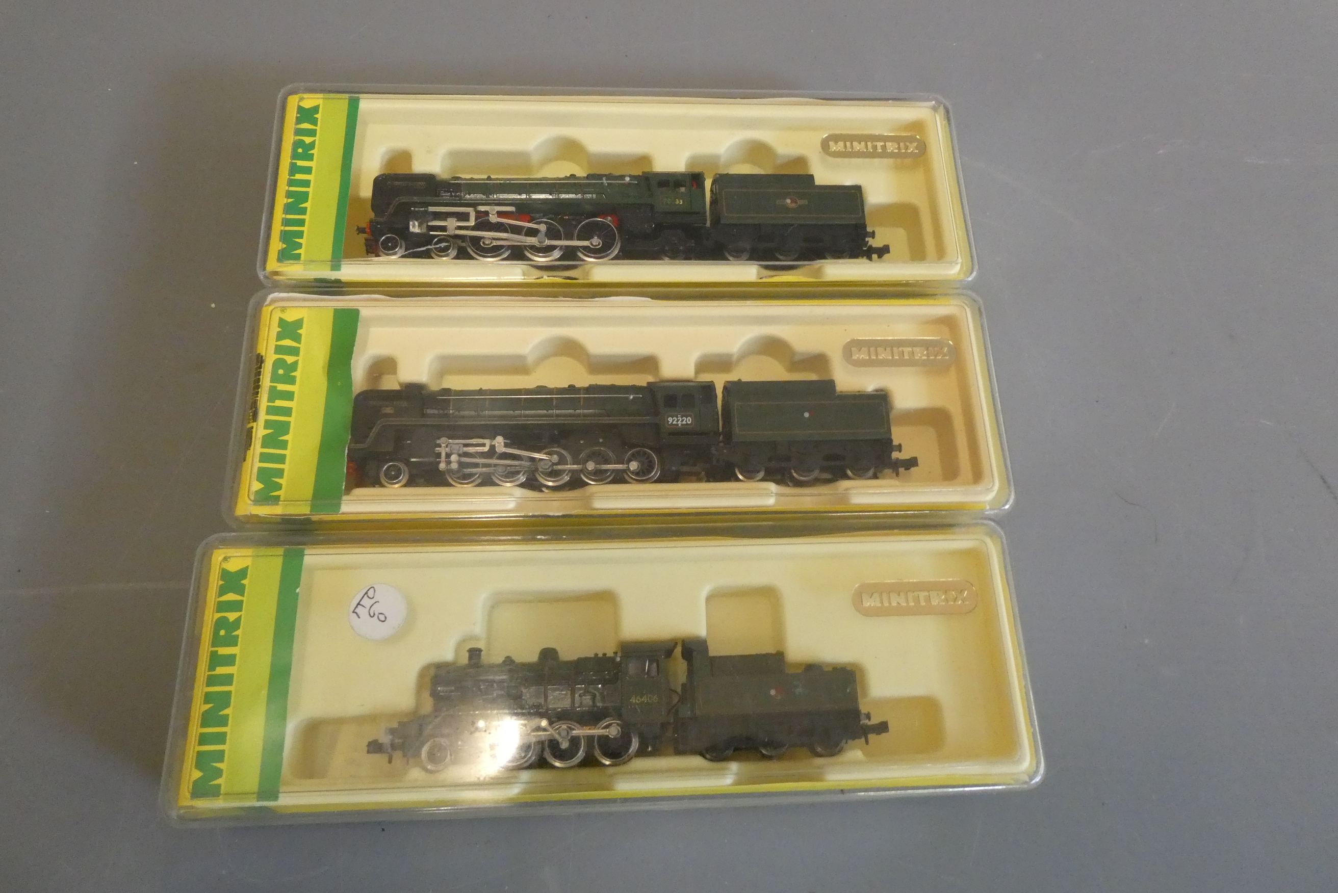 Three Minitrix N gauge locomotives comprising BR 9F, Britannia and BR green Class 4, some Image