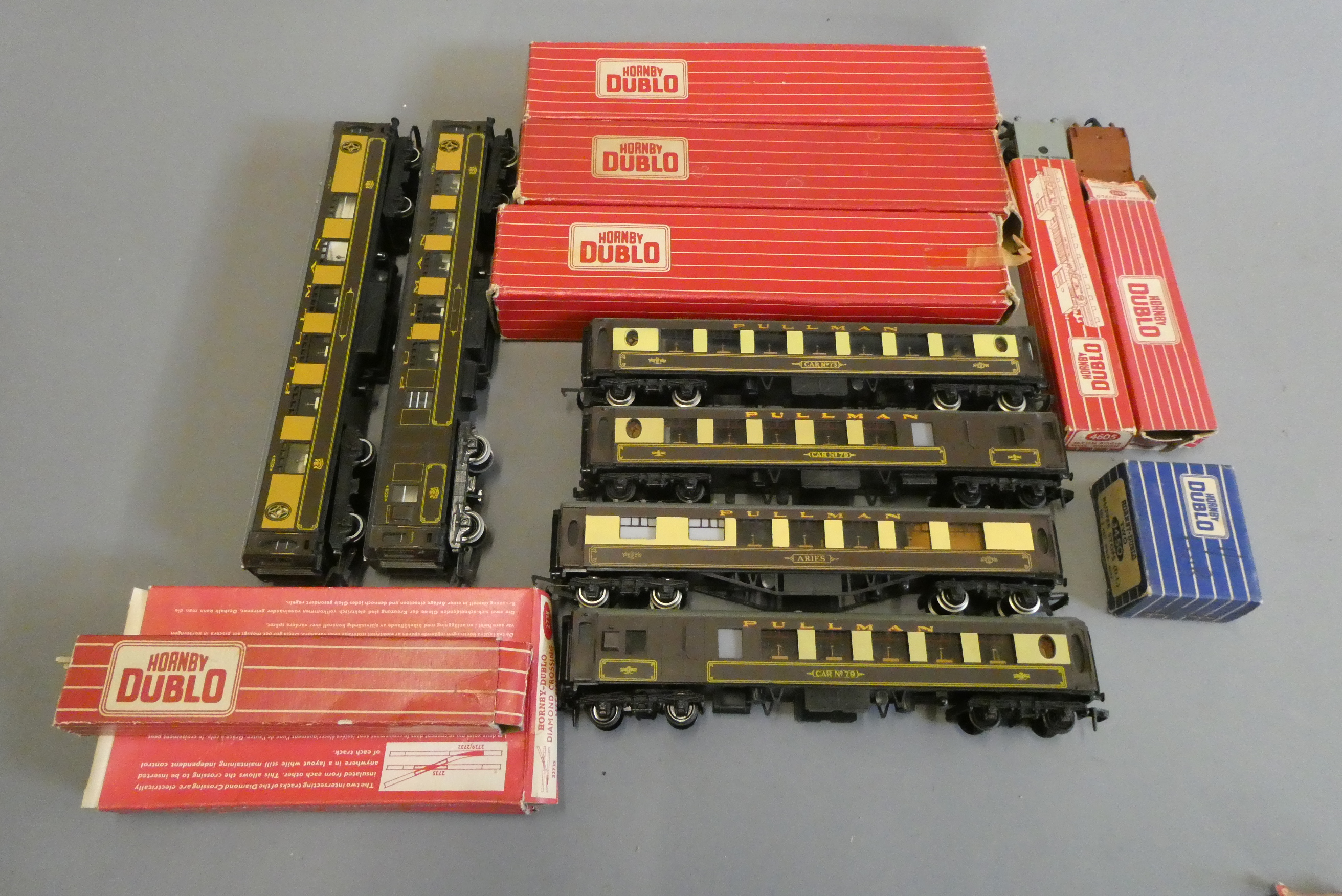 Seven Hornby Dublo Pullman coaches, two Hornby Pullman coaches, two goods wagons and three 2-rail Image