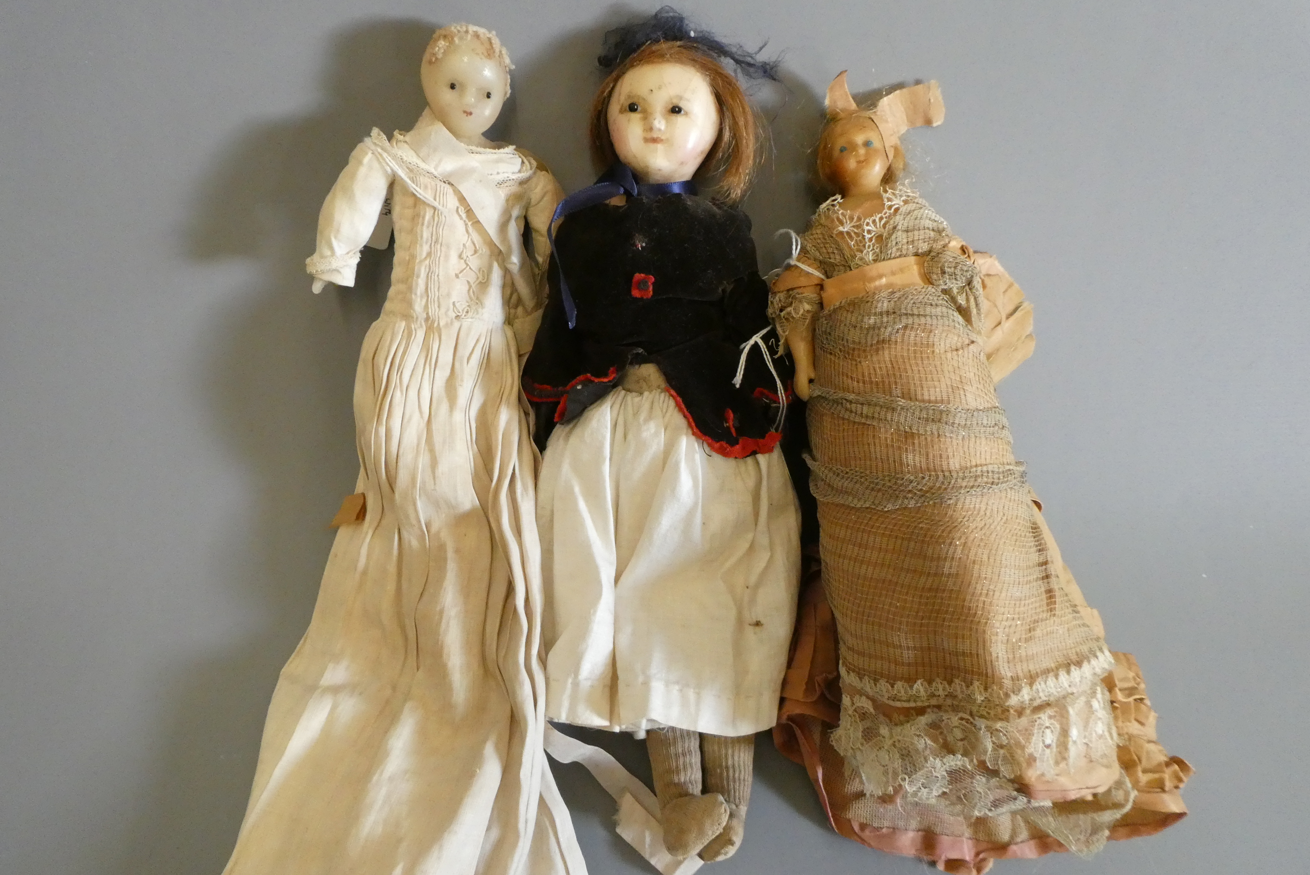 Three Victorian wax shoulder head dolls Image