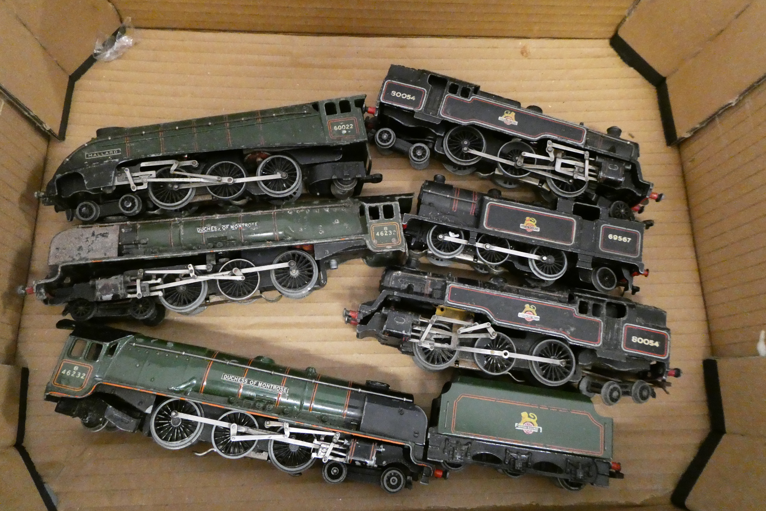 Playworn Hornby Dublo 3-rail locomotives, some have damage or parts missing, and five petrol tank Image