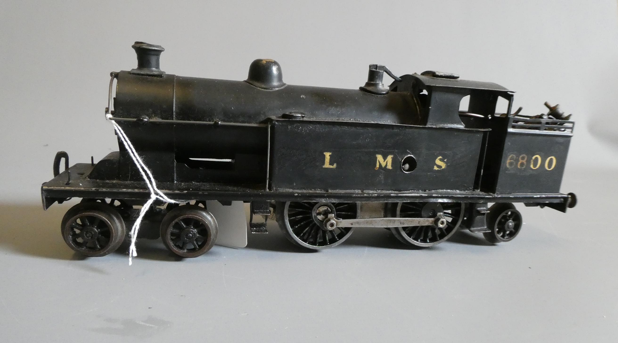 Bing LMS 4-4-2 tank locomotive, repainted black and fitted with Hornby 0-4-0 clockwork motor and Image