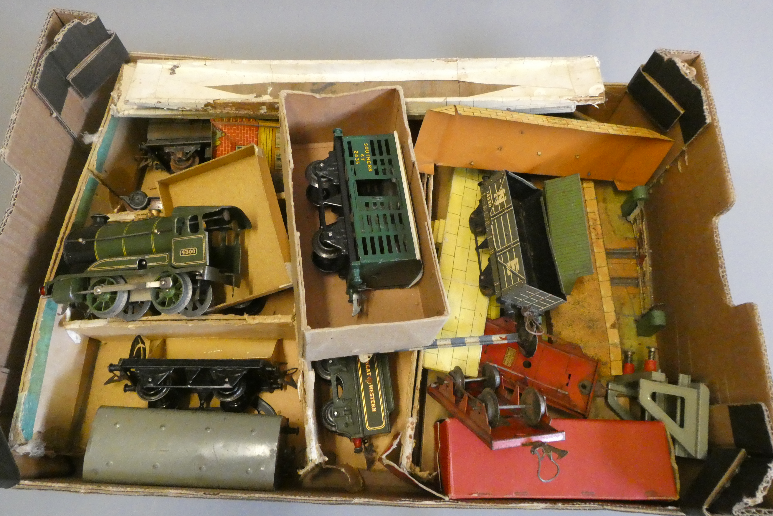 Playworn clockwork trains by Hornby including goods and passenger coaches, wagons and LNER Image