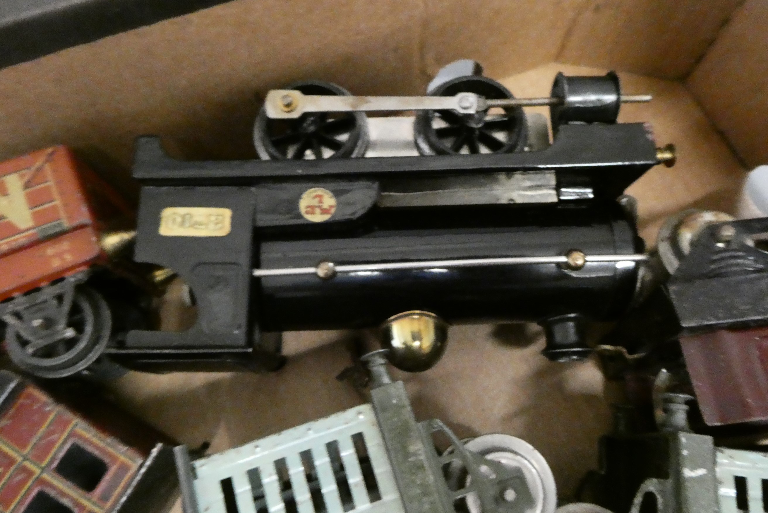 Hornby Clockwork 0-4-0 locomotive with a quantity of tinplate wagons and coaches by Hornby and Image